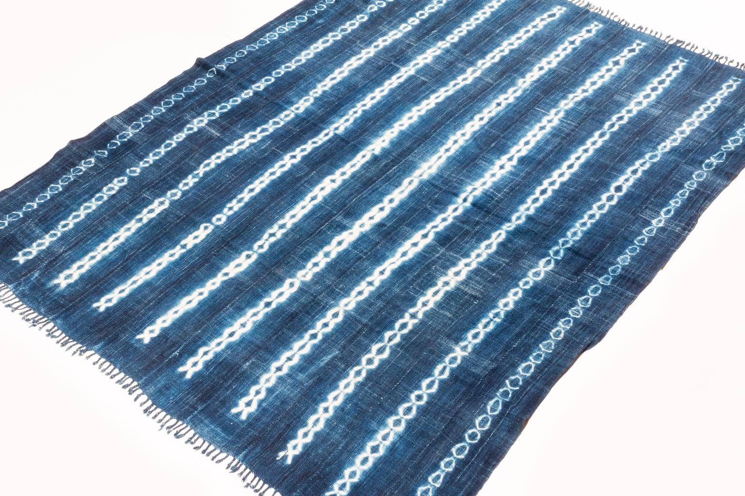 Very soft hand spun cotton, luminous indigo blue color with white design motfs. The ends are finished with nice braid-work. A great vintage tribal piece. Measures: 3'7