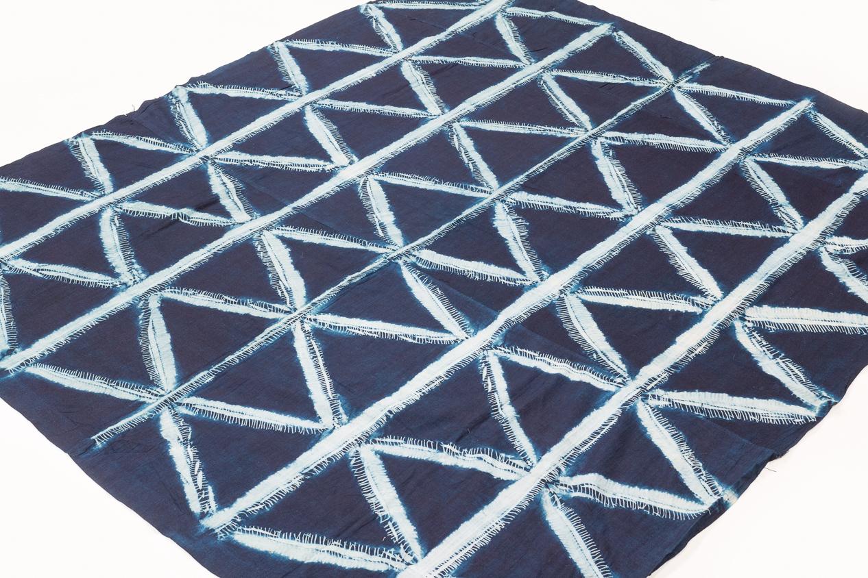 Just a stunning piece. This is a rare textile of exceptional artistic merit. The repetitive geometric motif is produced by a 'wax' resistance technique, similar to hollandaise wax techniques, create clean and graphic shapes. This would make a
