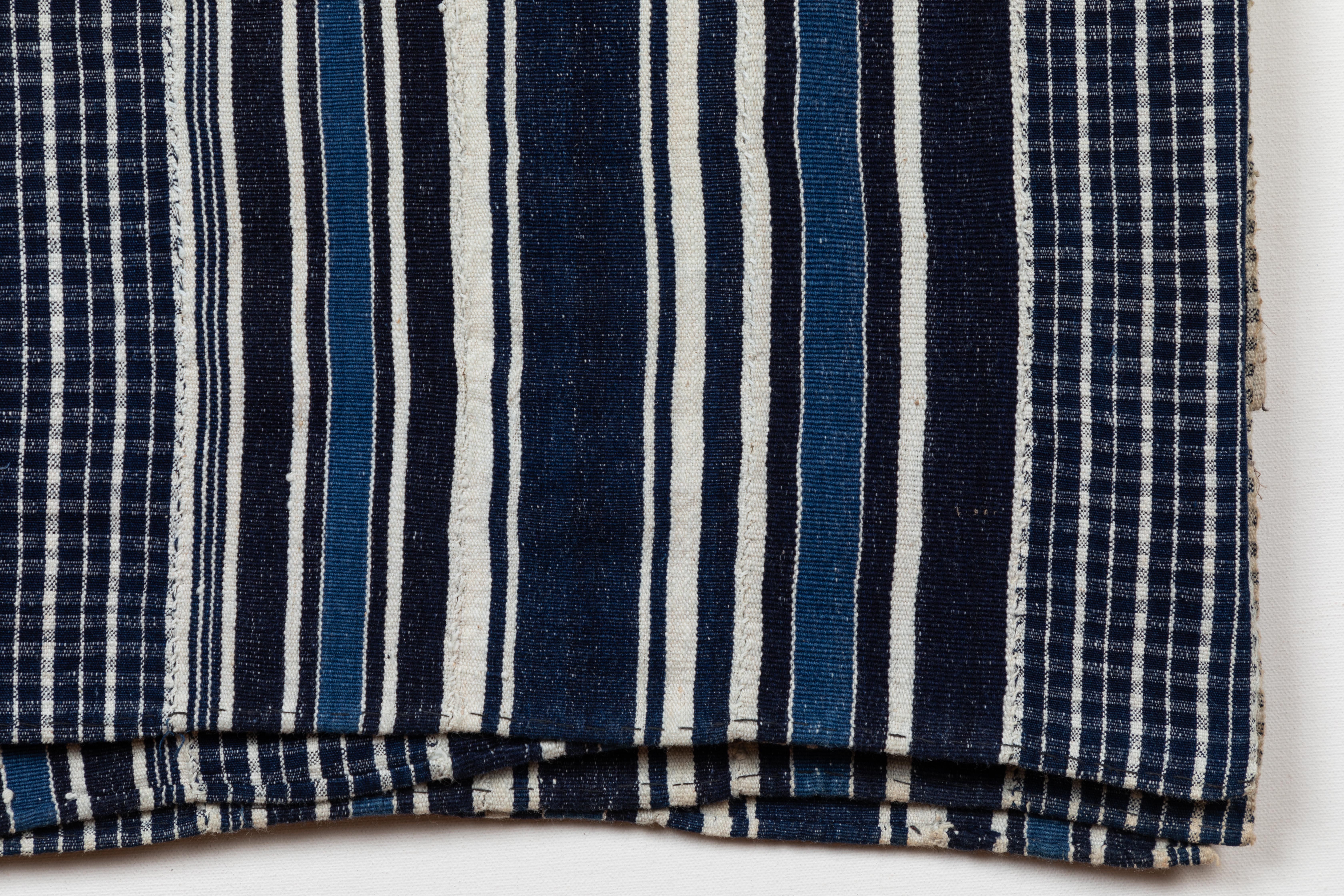 Natural dye indigo cotton handwoven textile. Woven in narrow, 3 inch strips and hand-sewn together. From Mali or Burkina Faso, West Africa.
