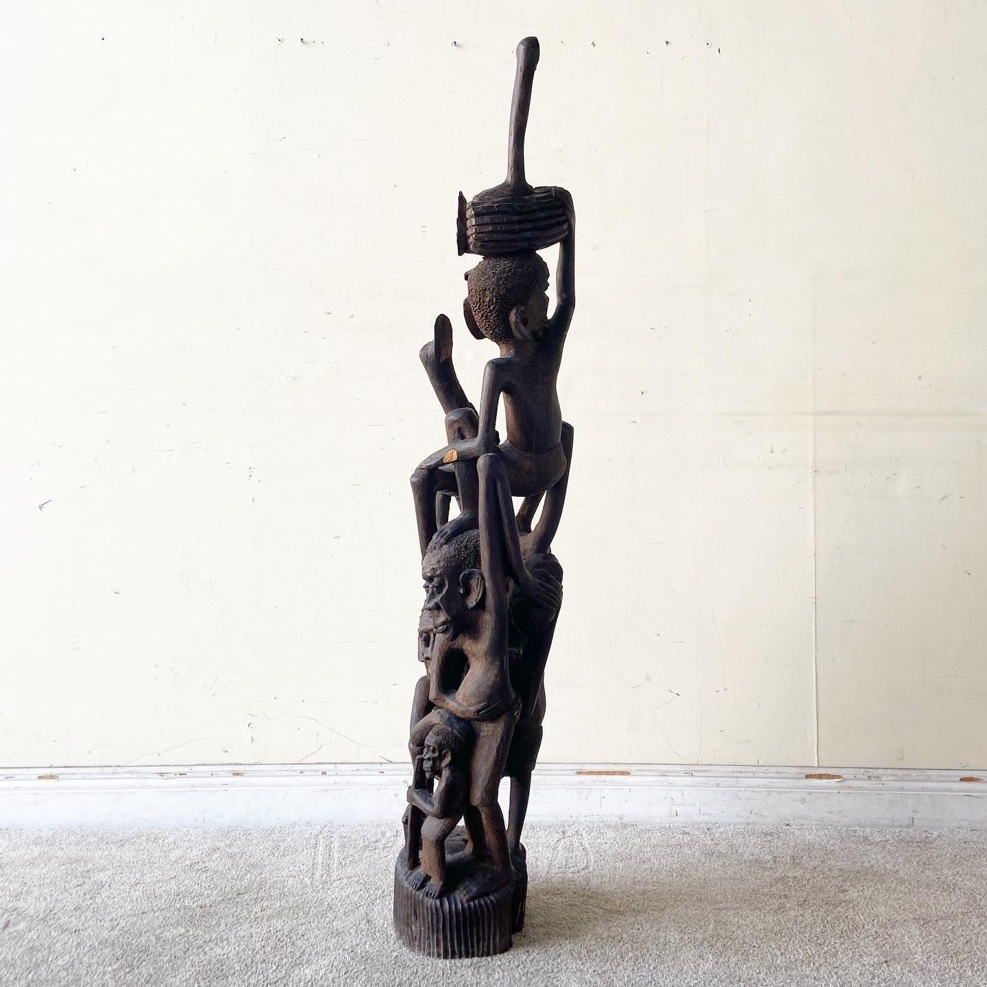 Vintage African Makonde Tree of Life Sculpture, hand-carved and symbolic, adds cultural depth and unique artistry to your home or office decor.
 
 Top section is broken off as shown in the photos. We sell all items in the condition we acquire them,