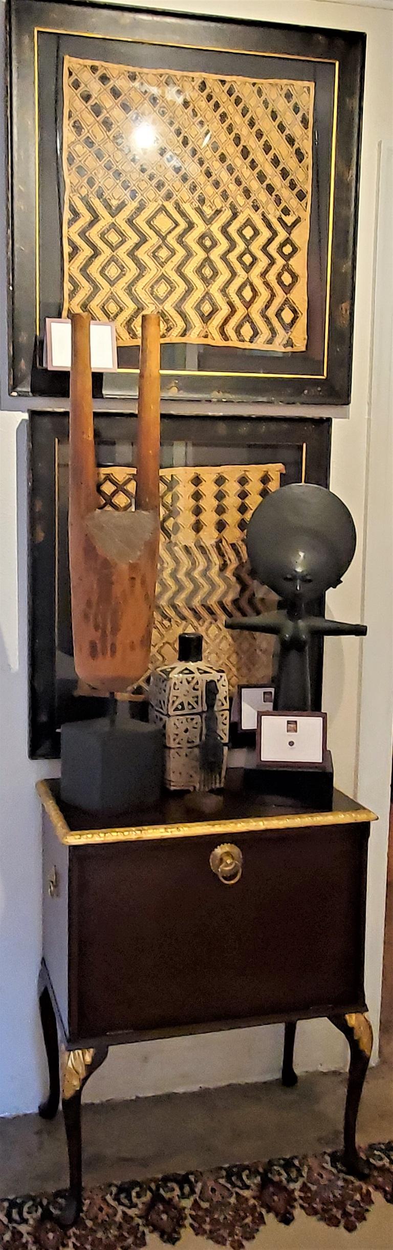 Presenting a lovely vintage African mounted wooden sculpture.

Made circa 1960 most likely in West Africa by the Luba Tribe.

It is a large wooden sculpture made from a solid piece of African hardwood with a block base and 2 arms extending