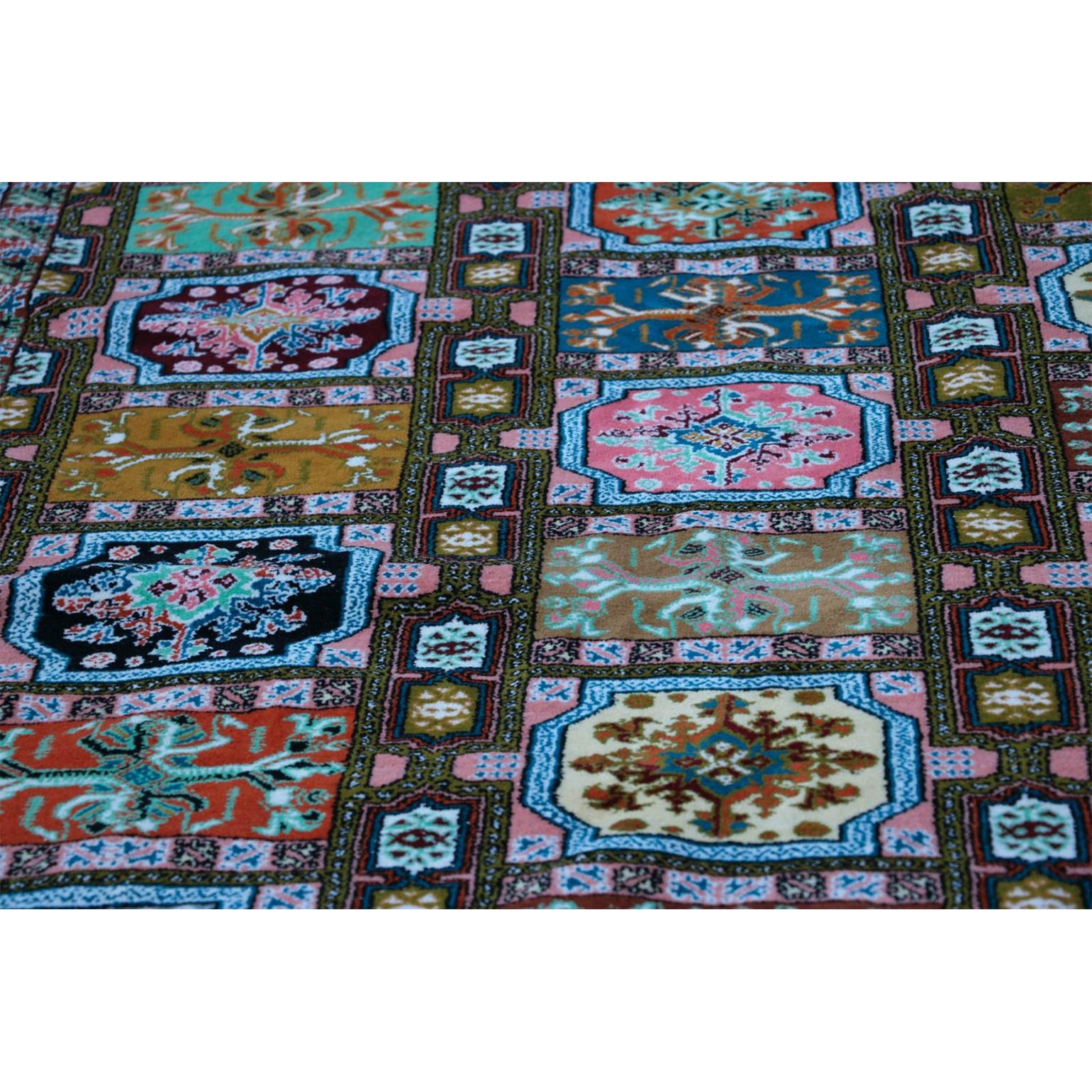 A positively gorgeous African rug from the region of Morocco or Tunisia. It is an interesting and highly complex canopy of colors for your floor, the host of woven durable full pile fibers, geometrical representations of intricate designs that take