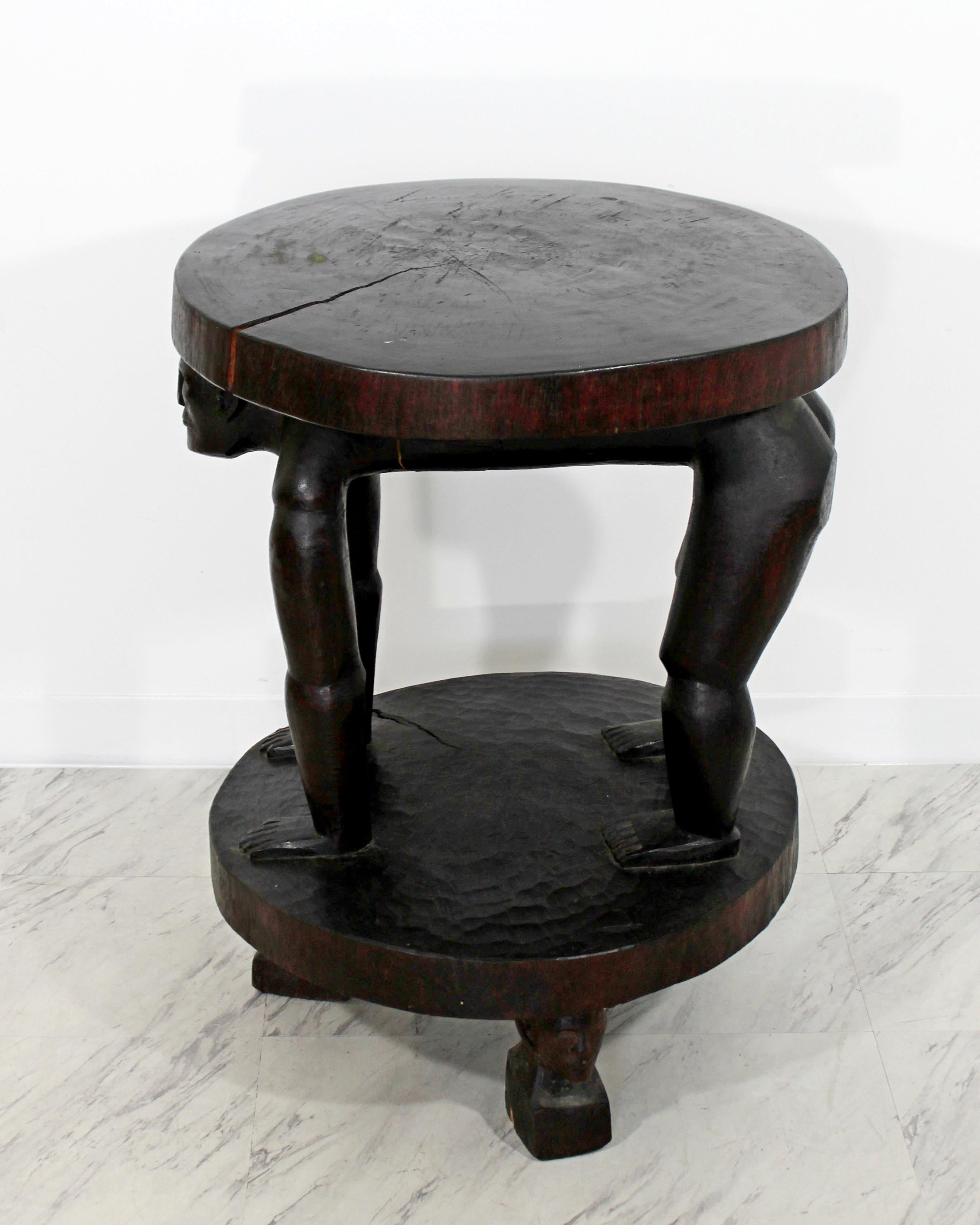 For your consideration is a vintage carved rosewood stool in the style of an African stool, in the shape of a monkey man on all fours. In vintage condition. The dimensions are 23.5