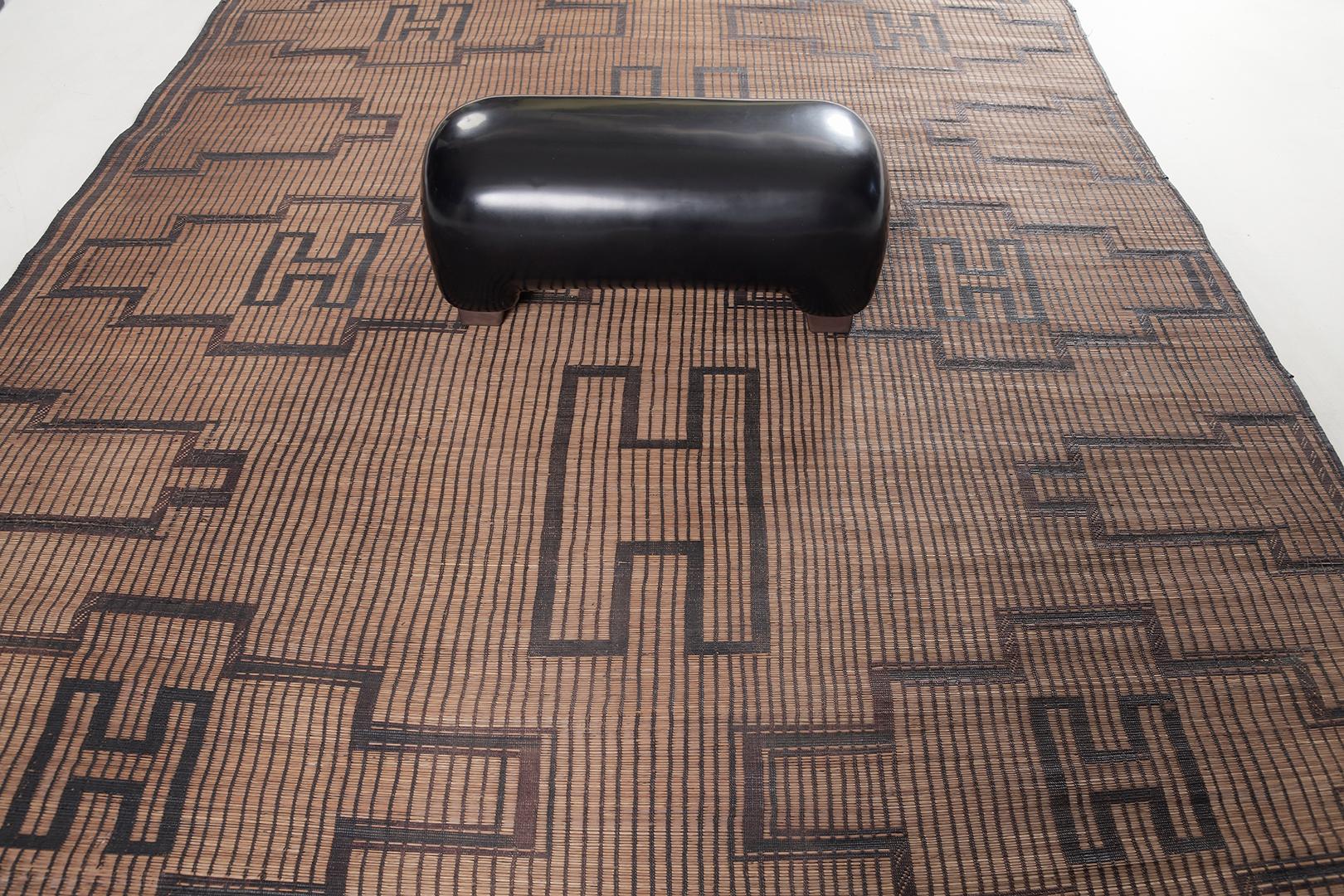 Endow your room with history and sophistication with our Tuareg mat. It highlights the geometric patterns that turn into a map. Known for their durability, these are made from reed and camel leather that can last a lifetime. Stylish for every