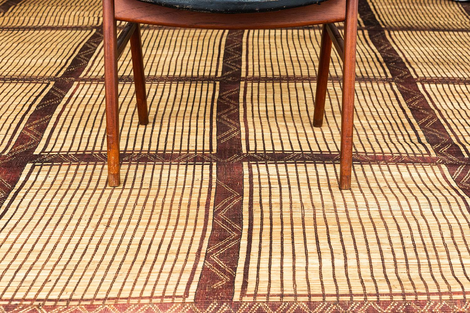 A beautiful and unique vintage Tuareg. This piece is handwoven of reed and leather by one of the oldest nomadic groups of the Saharan trade routes, the Tuaregs. This piece will elevate any design space with its tribal design and eye catching texture.
