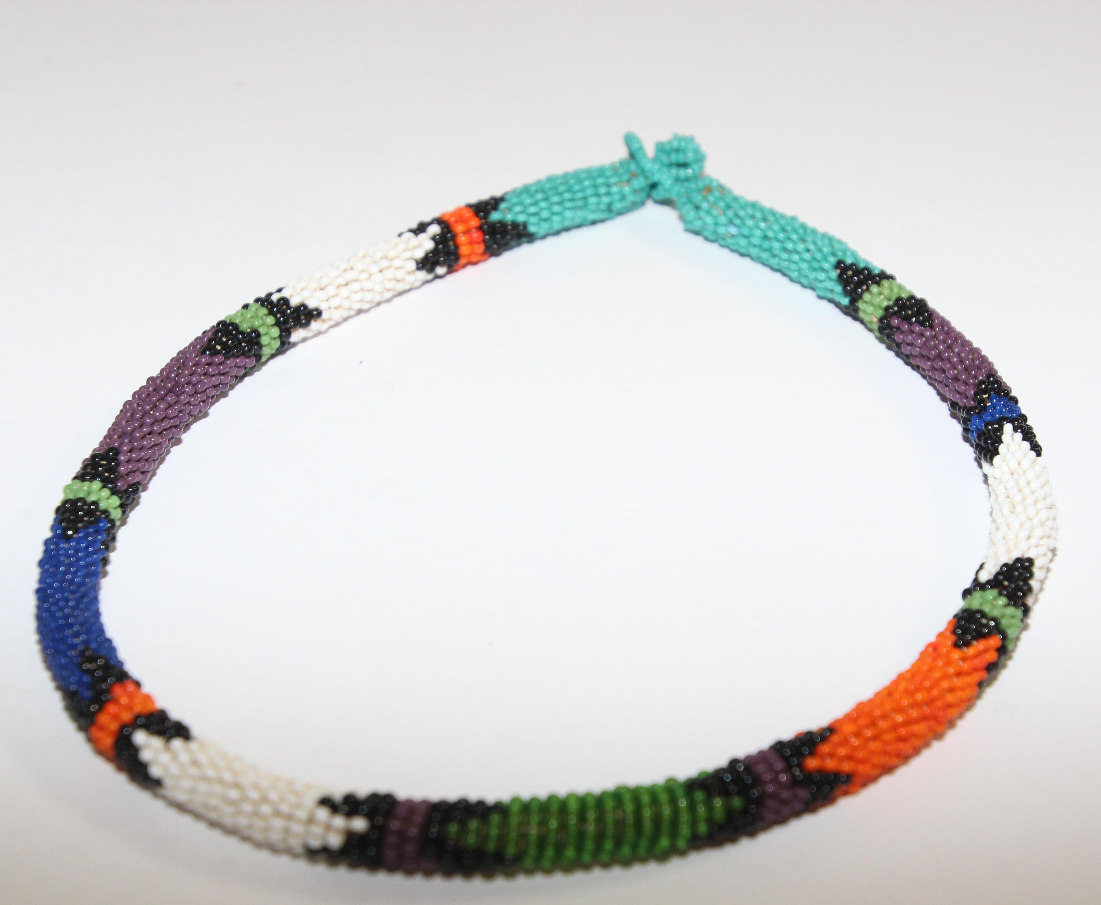 Vintage African Urembo beaded necklace choker.
Handmade in Kenya by the maasai tribe.
Urembo means “beauty” and the handmade pattern and unique color pairings will make a bold statement.
Size: 21