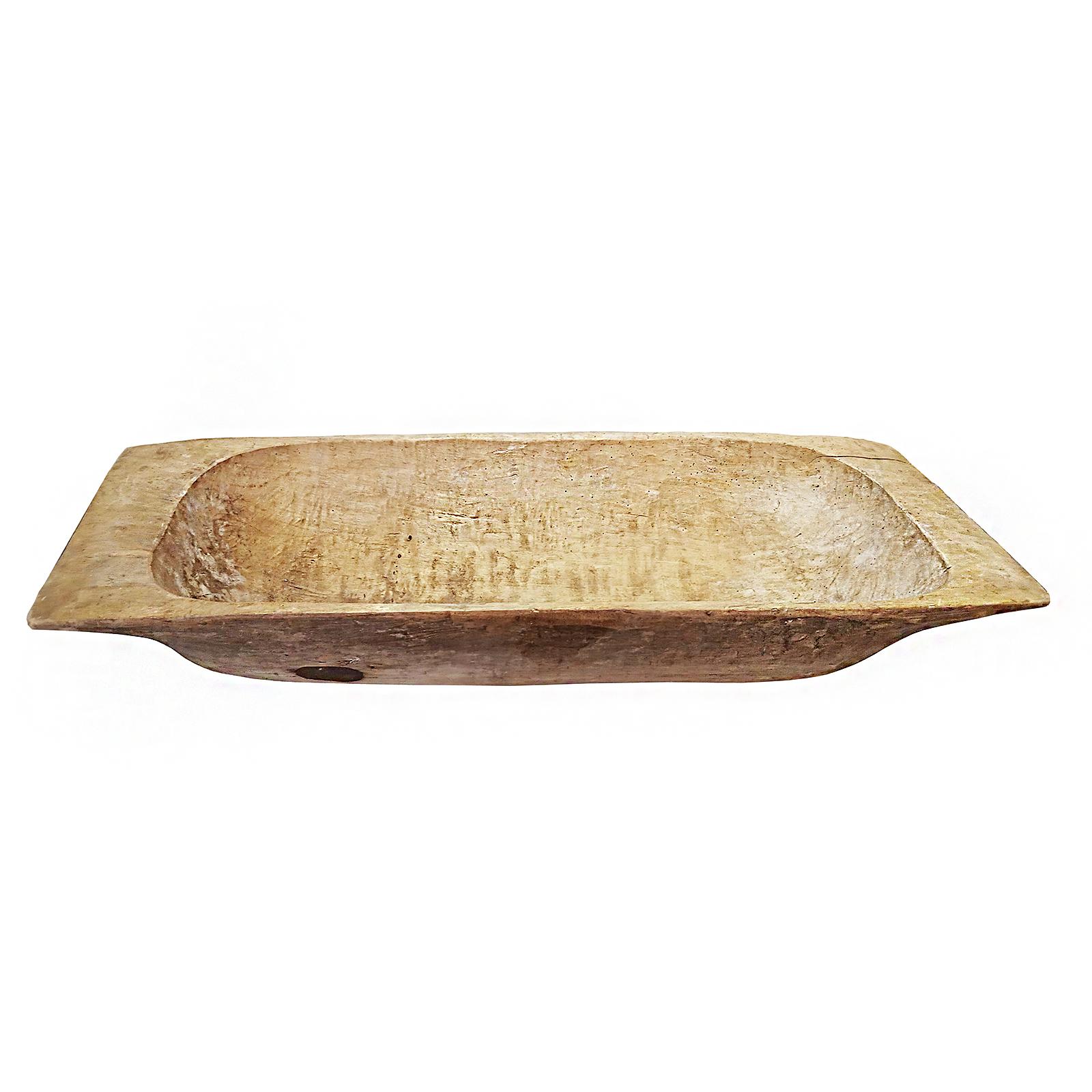 A vintage Tanzanian wooden trough, circa 1940. 
Hand-carved out of blonde wood. Contains a metal patch. 

Can be used as an indoor decorative object, as a cachepot for a mini-garden, or as an outdoor patio element. 