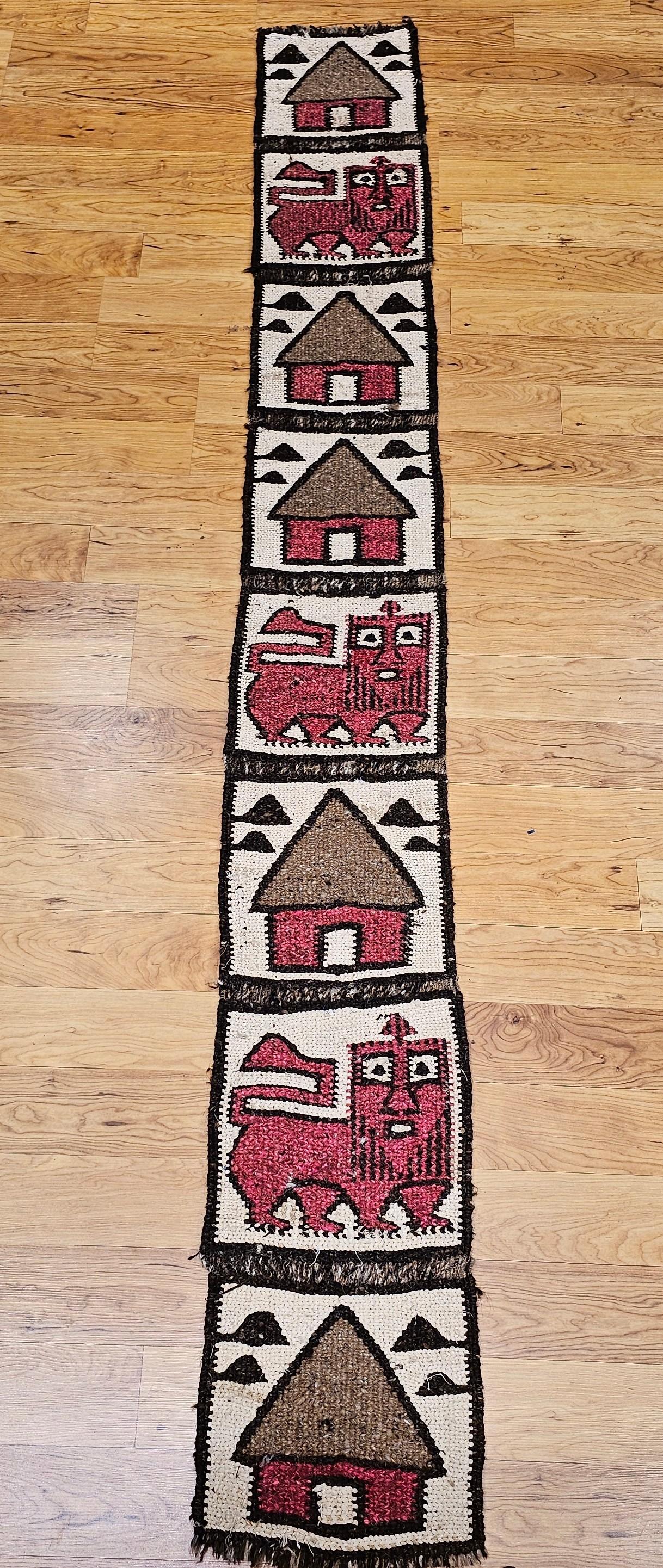 Simple and beautiful handwoven African table runner or wall hanging art depicting a series of huts and lions.  The item can be used as a table runner or hung as a primitive wall art.  It can also be divided into two sections and mounted and used as