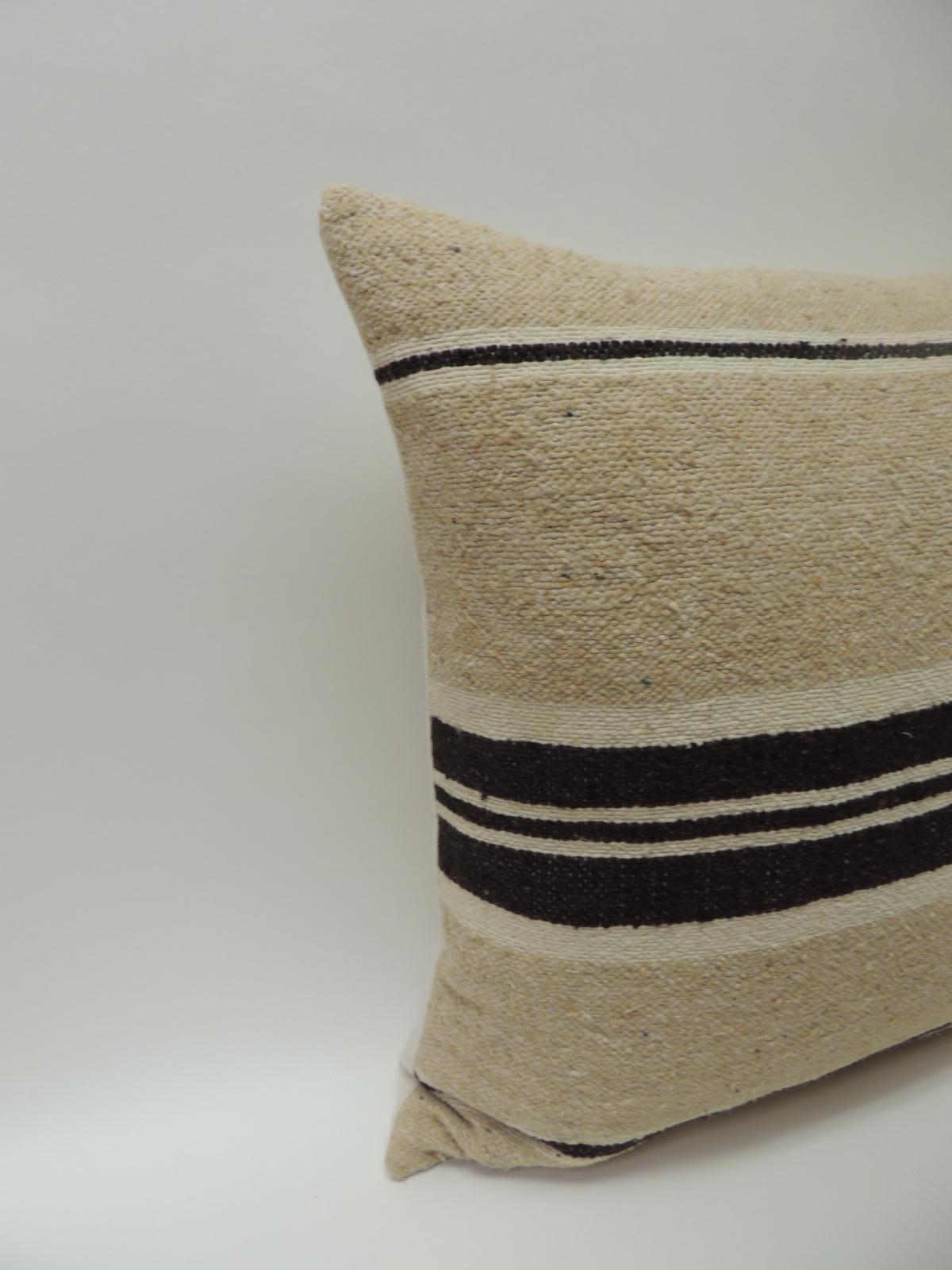 Vintage African woven tribal artisanal textile decorative pillow
Tunisian vintage artisanal tribal textile decorative pillows handcrafted from the vintage wool and hemp hand-loomed by the Berber tribes from the Atlas Mountains of Morocco. Natural