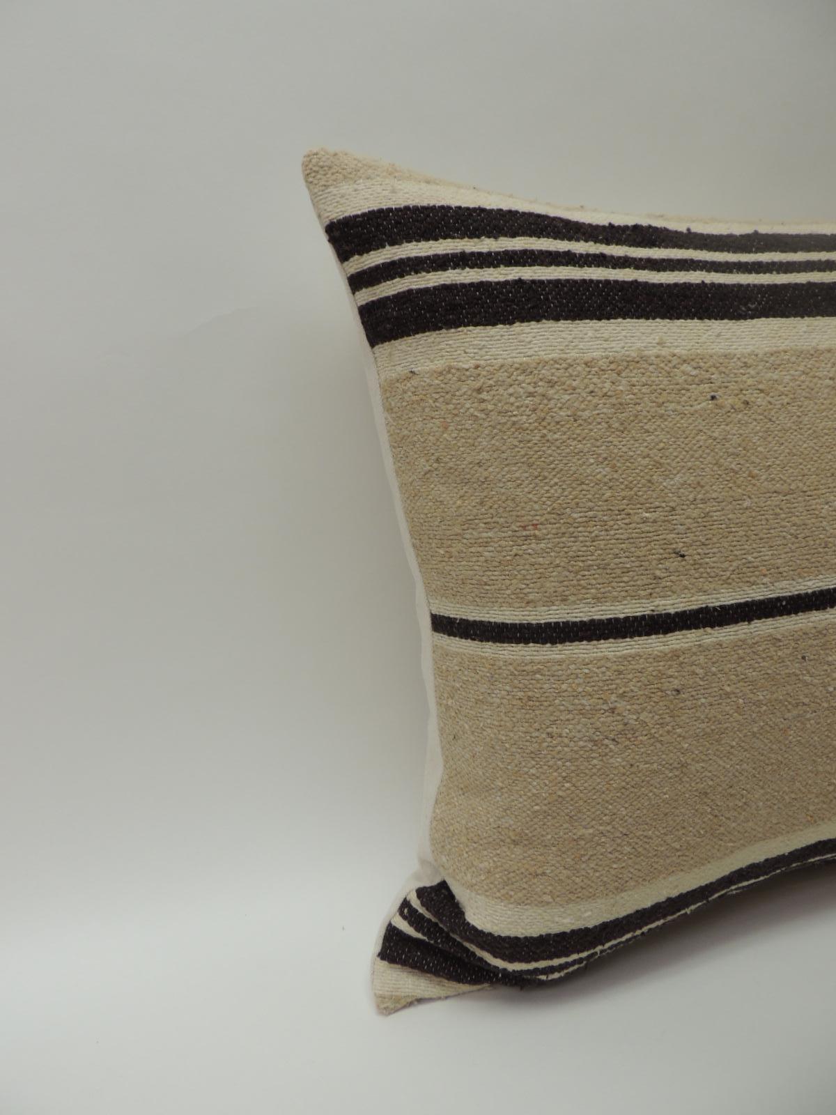 Vintage African woven tribal artisanal textile decorative pillow.
Tunisian vintage artisanal tribal textile decorative pillows handcrafted from the vintage wool and hemp hand-loomed by the Berber tribes from the Atlas Mountains of Morocco. Natural