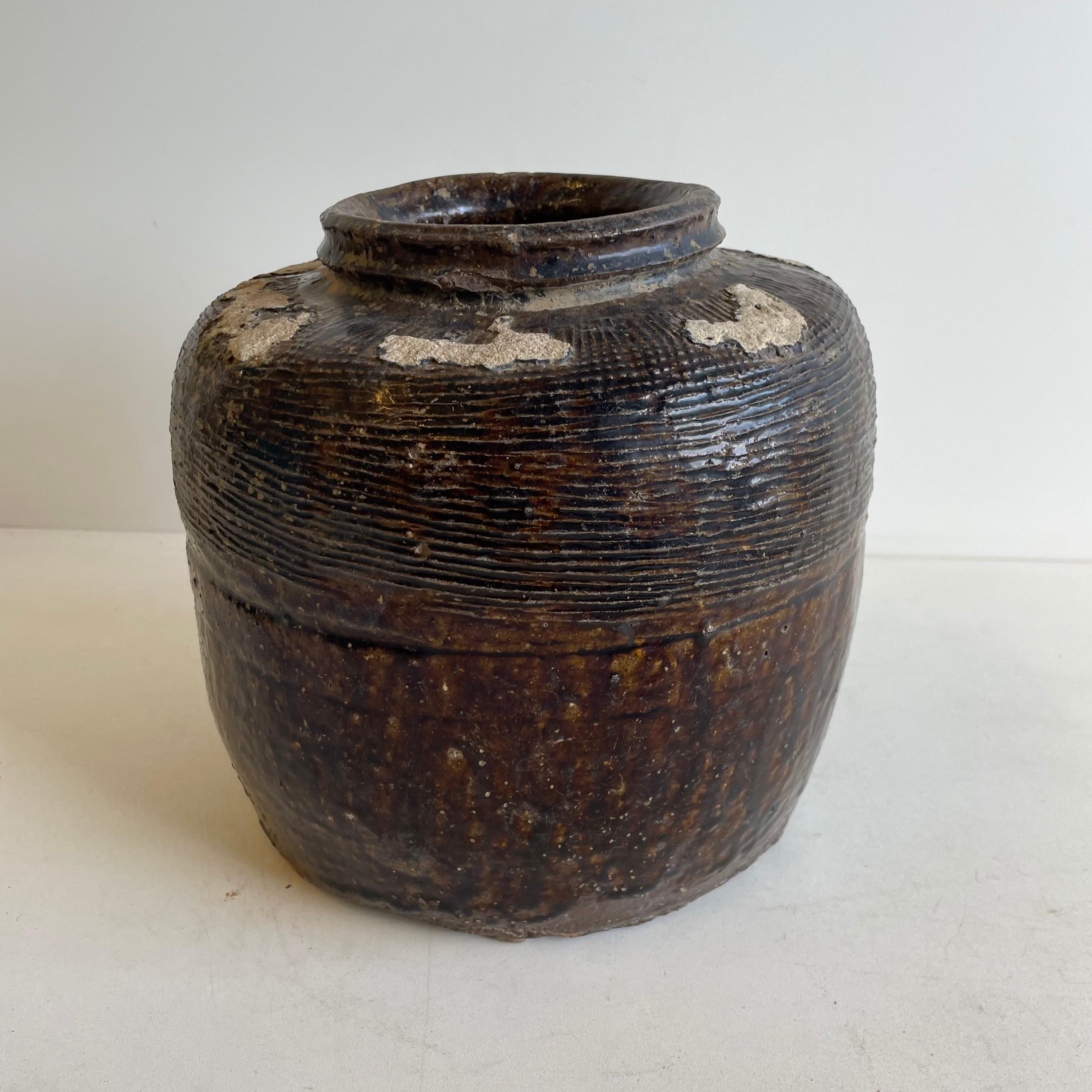 Beautifully glazed and rich in character, this vintage glazed oil pot adds just the right amount of texture + warmth where you need it. Stunning glazed finish with warm terra-cotta accents.
Coloring is an olive green, dark brown tones.
Each piece