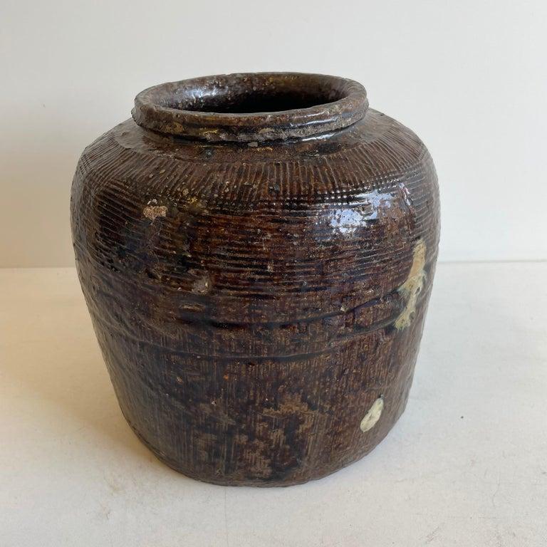 Beautifully glazed and rich in character, this vintage glazed oil pot adds just the right amount of texture + warmth where you need it. Stunning glazed finish with warm terra-cotta accents. Coloring is an olive green, dark brown tones.
Each piece is