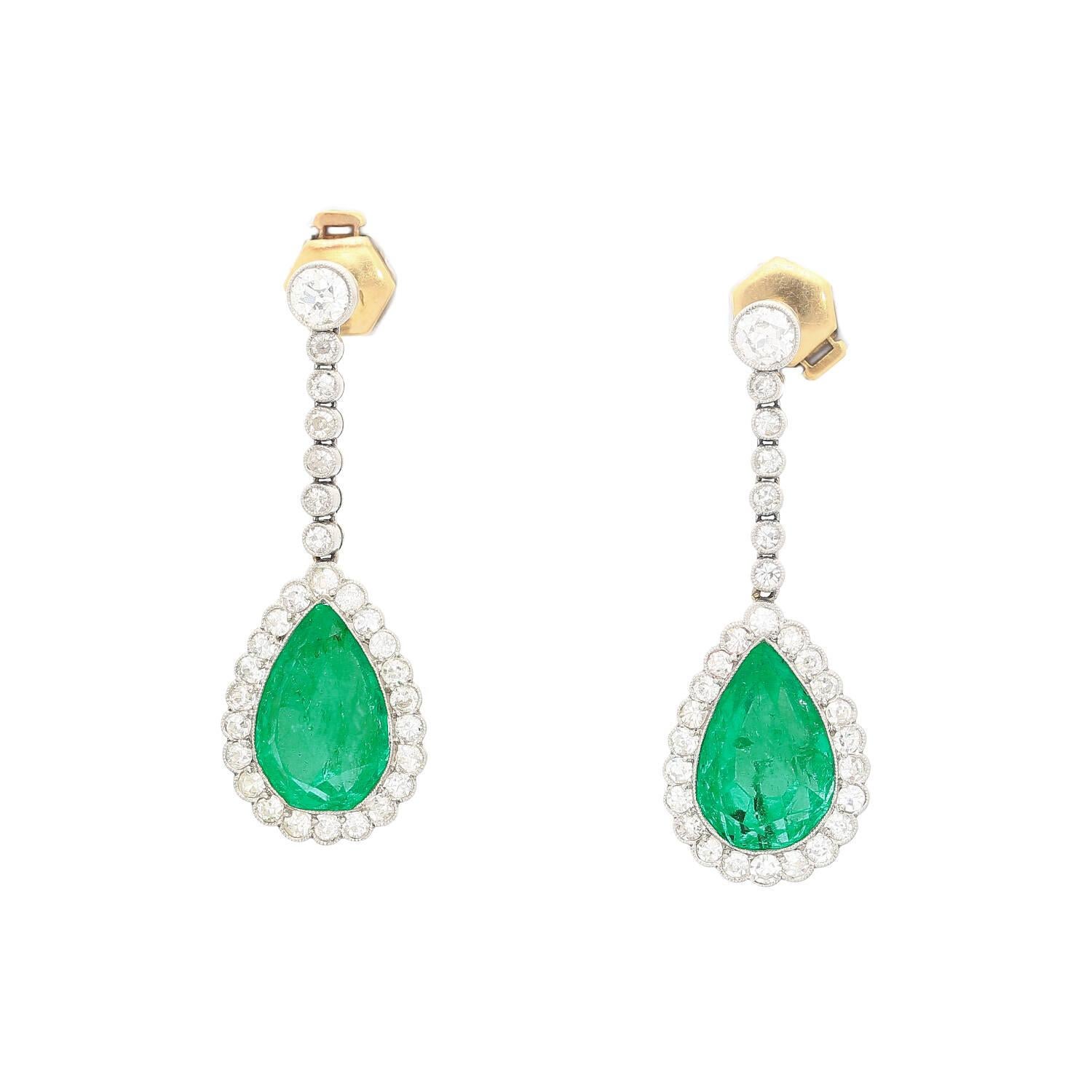 Natural 10-carat pear cut Colombian emerald and round cut diamond drop earrings in a platinum and gold setting. AGL Certified the center stone pair as natural emeralds, Colombian origin, and bearing minor oil. Mounted with a gold prong setting that