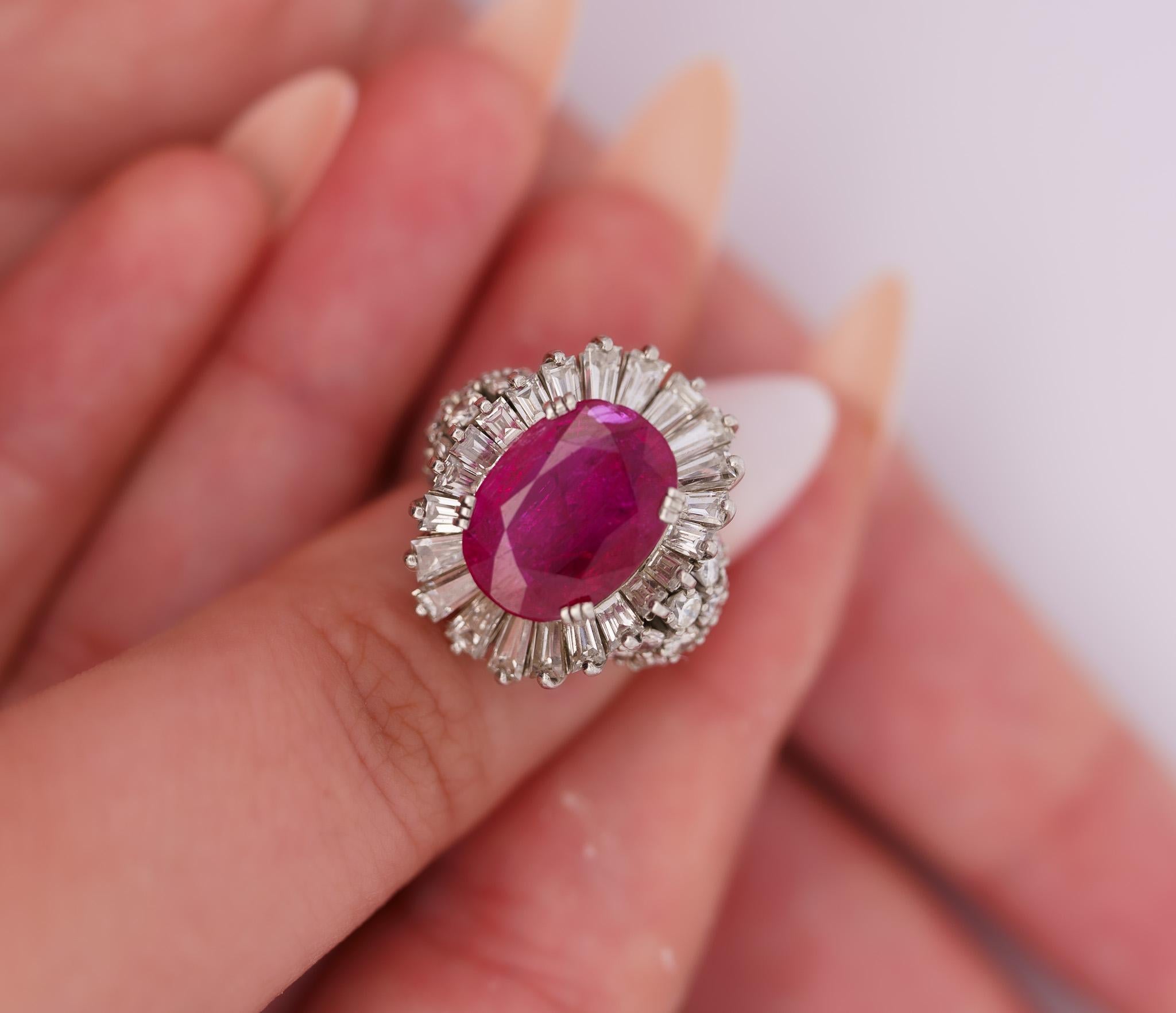 Vintage No Heat Burma Ruby & Diamond Cocktail Ring. 

This vintage ring features a natural, no-heat 6.95-carat oval-cut red ruby center stone with AGL certification. The ruby is paired with diamond side stone detailing of 22 baguette-cut and 20