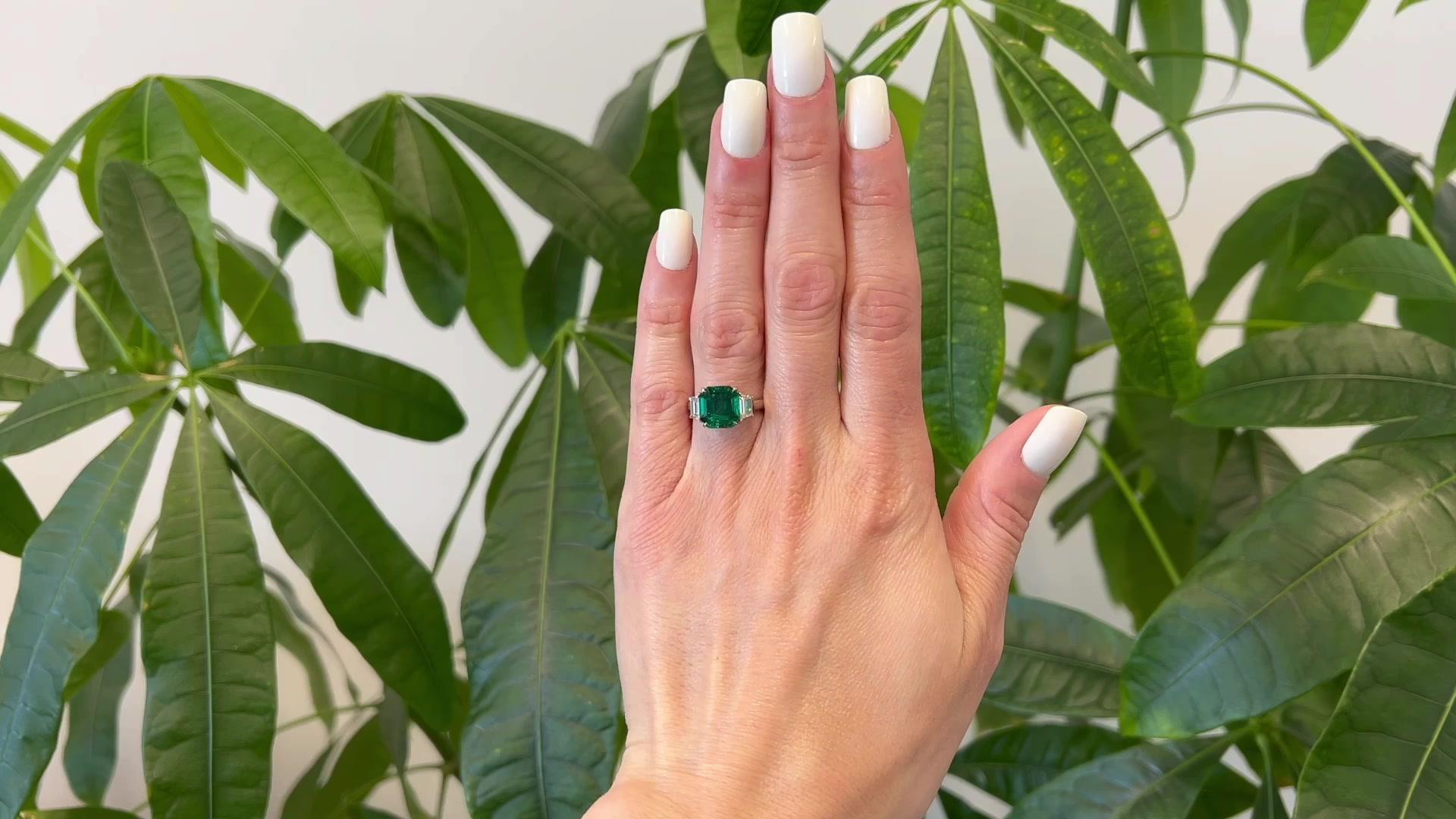 One Vintage AGL SSEF 2.51 Carats Colombian Emerald Diamond Platinum Ring. Featuring one AGL and SSEF certified octagonal step cut emerald of 2.51 carats, accompanied with AGL #1129374 and SSEF #109918 stating the emerald is of Colombian origin and