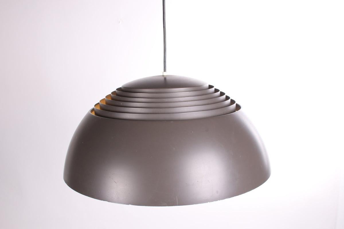 Vintage AJ Royal Pendant Lamp by Arne Jacobsen

This modern design classic, the AJ Royal hanging lamp, was designed in 1957 by Arne Jacobsen and produced by Louis Poulsen. Jacobsen designed the SAS Royal hotel in Copenhagen for the airline SAS