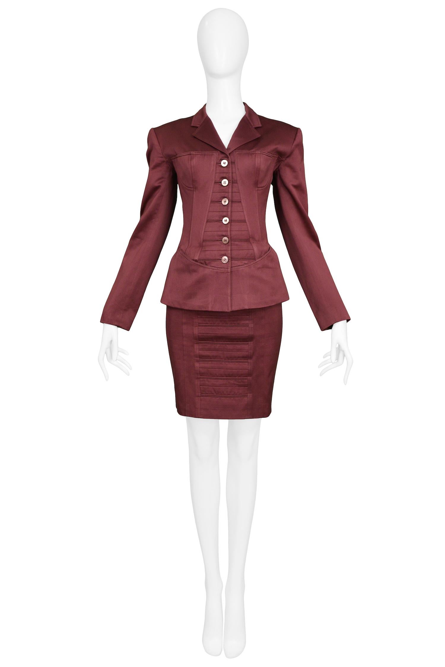 Vintage Azzedine Alaia burgundy corset skirt suit with bra detail and tonal buttons. From the Spring / Summer 1992 Collection. 

Excellent Condition.

Size 38
Jacket Measurements:
Shoulder 16.75