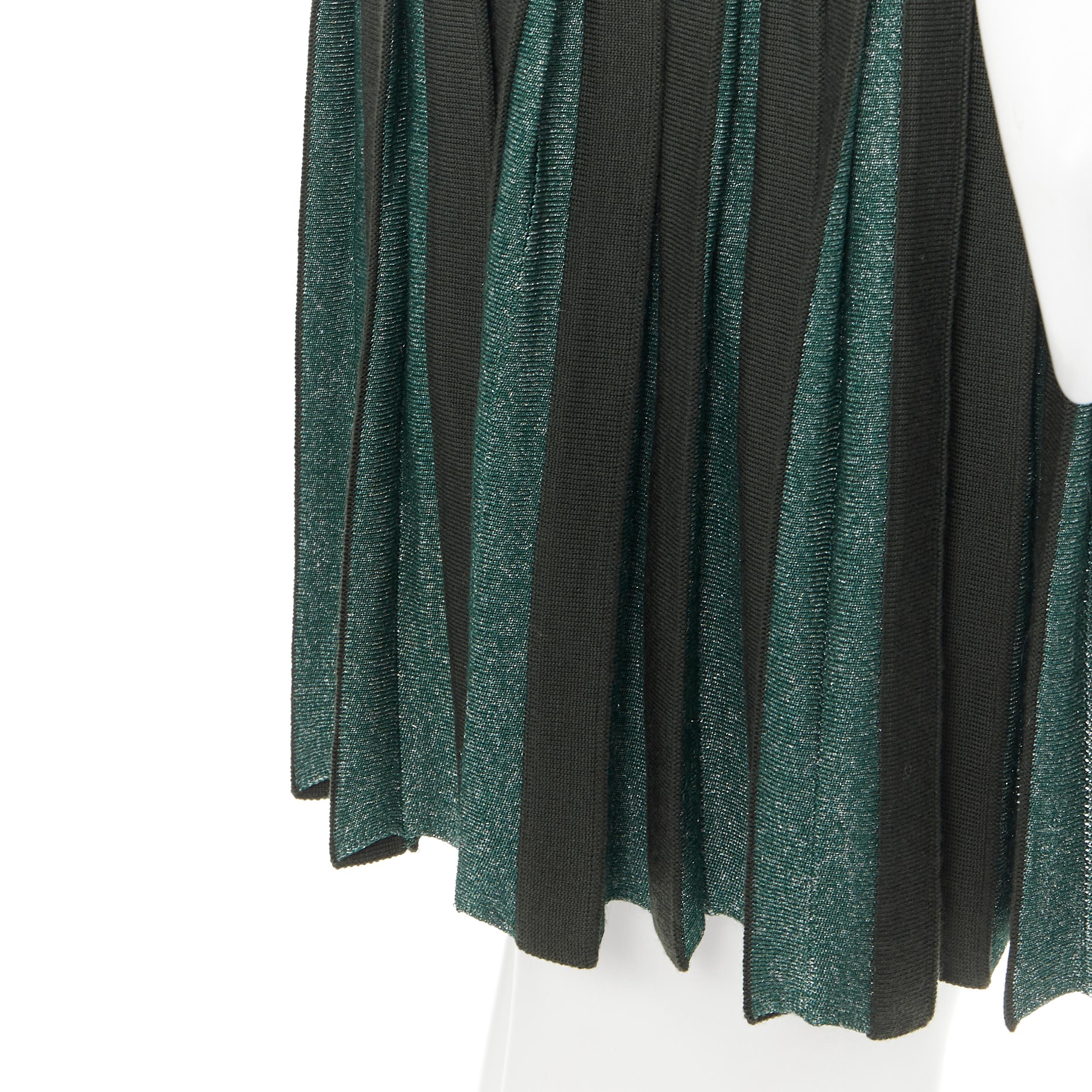 vintage ALAIA dark green wool blend pleated hem wrap flared skirt FR40 M 
Reference: GIYG/A00001 
Brand: Alaia 
Designer: Azzedine Alaia 
Material: Wool 
Color: Green 
Pattern: Solid 
Closure: Hook & Eye 
Extra Detail: Wrap skirt. Pleated hem