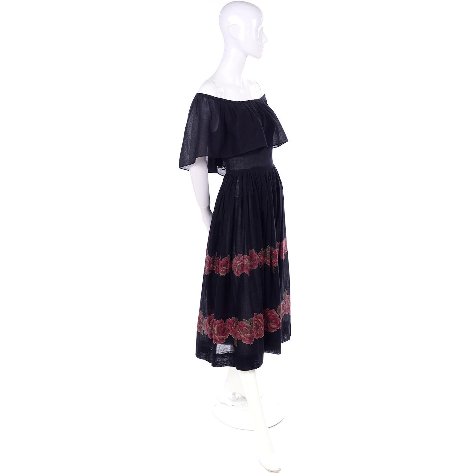 This is a fun Albert Nipon vintage semi Sheer black cotton voile dress with two rows of rose floral print around the bottom of the skirt. The dress can be worn as shown or on the shoulders. We love Albert Nipon and really think he had a knack for