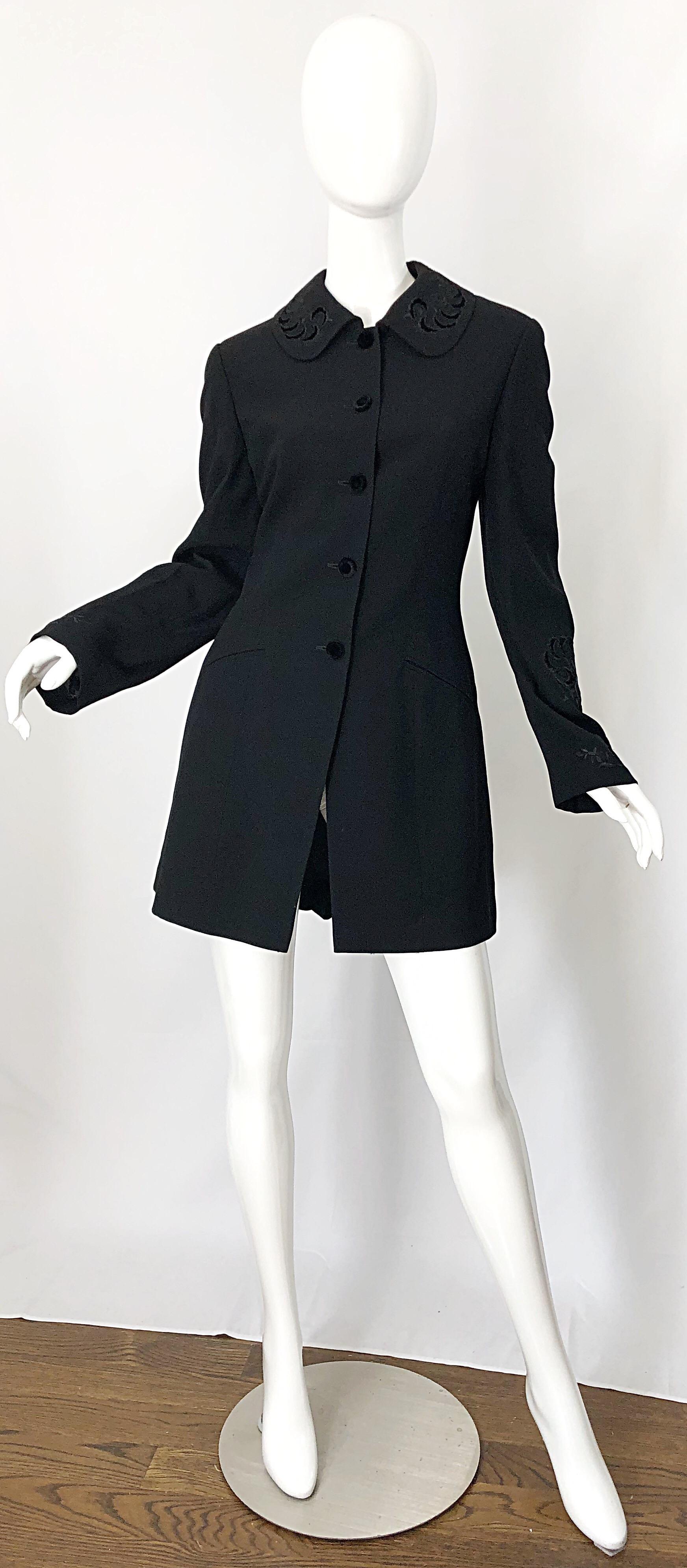 Expertly tailored and timeless ALBERTA FERRETTI black wool, rayon and velvet jacket! Features velvet and silk embroidery throughout. Black velvet covered buttons up the front. Pleating at the bottom center hem adds just the right amount of movement.