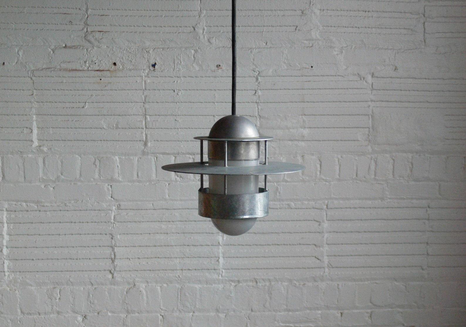 Albertson pendant lamp

Jens Møller-Jensen
Denmark, 1963

Galvanized steel ‘Albertson’ pendant lamp designed by Jens Møller-Jensen, produced with Louis Poulsen. This series was designed in Denmark of 1963 for a residential project located in