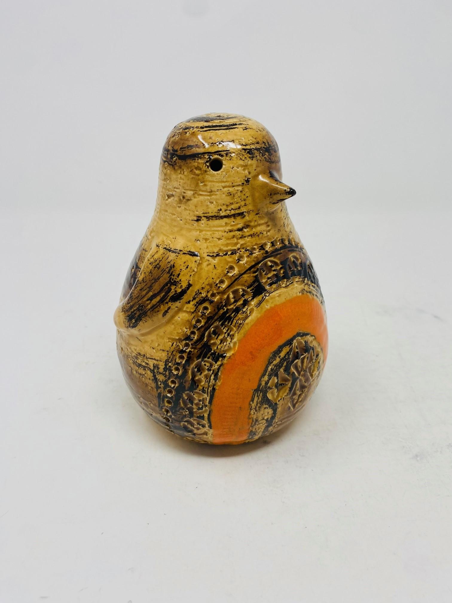 Beautiful and rare and very collectible penguin sculpture by Aldo Londi for Bitossi Raymor, circa the 1960s. The piece is in very great vintage condition with great color and texture.  A delightful grouping of brown tones glaze this piece that is