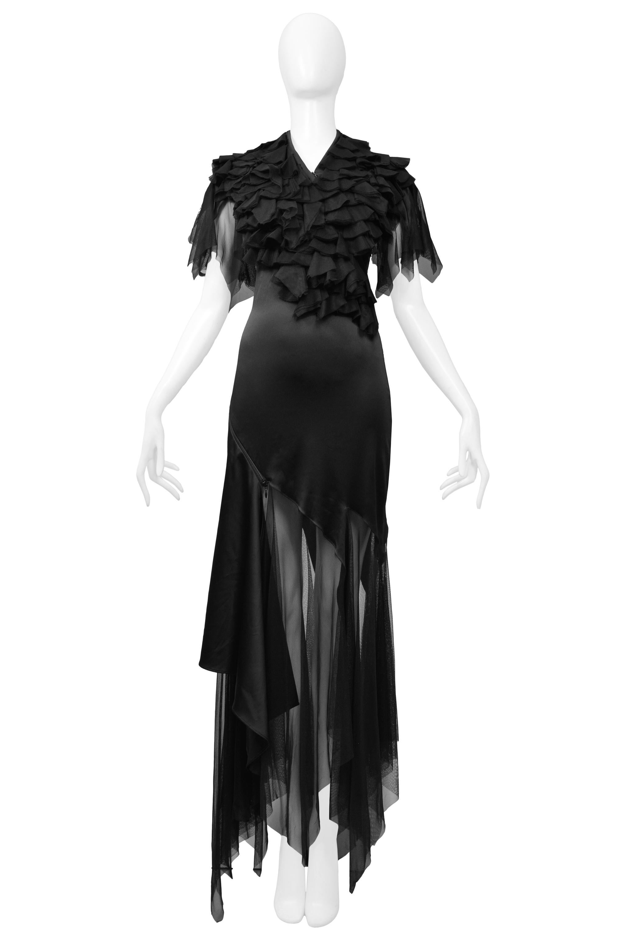 Resurrection Vintage is excited to offer an Alexander McQueen black stretch satin gown featuring a spiral zipper from the neckline to the hem, a ruffle tulle top and flutter sleeves, and asymmetrical handkerchief tulle hem. Look number 42 from the