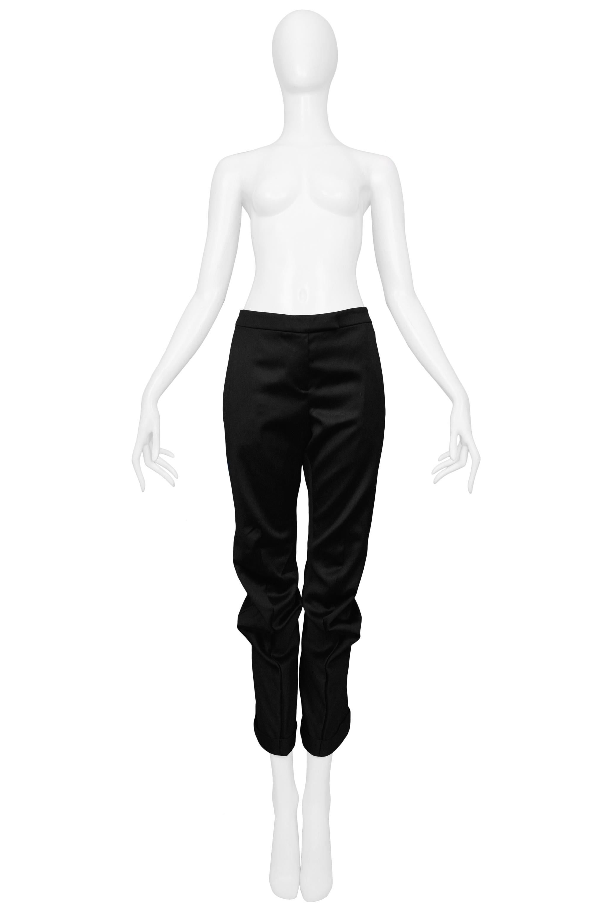 Resurrection Vintage is excited to present a pair of vintage Alexander McQueen black pants featuring curved front seams at the knees, zipper front, and cuffs at the hem. 

Alexander McQueen
Size: 40
100% Wool 100% Rayon Lining
Excellent Vintage