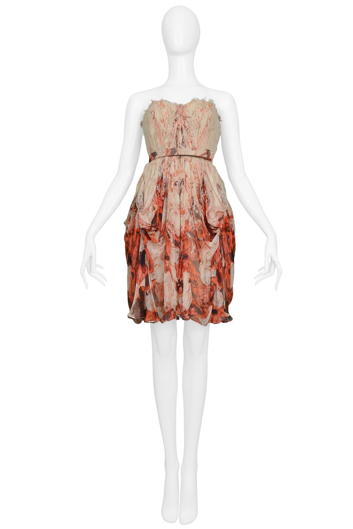 Vintage Alexander McQueen chiffon cream and red floral print strapless dress with interior corset, raw edges, gathered skirt, and coordinating belt. Circa 2009.

Good Vintage Condition.

Size 38