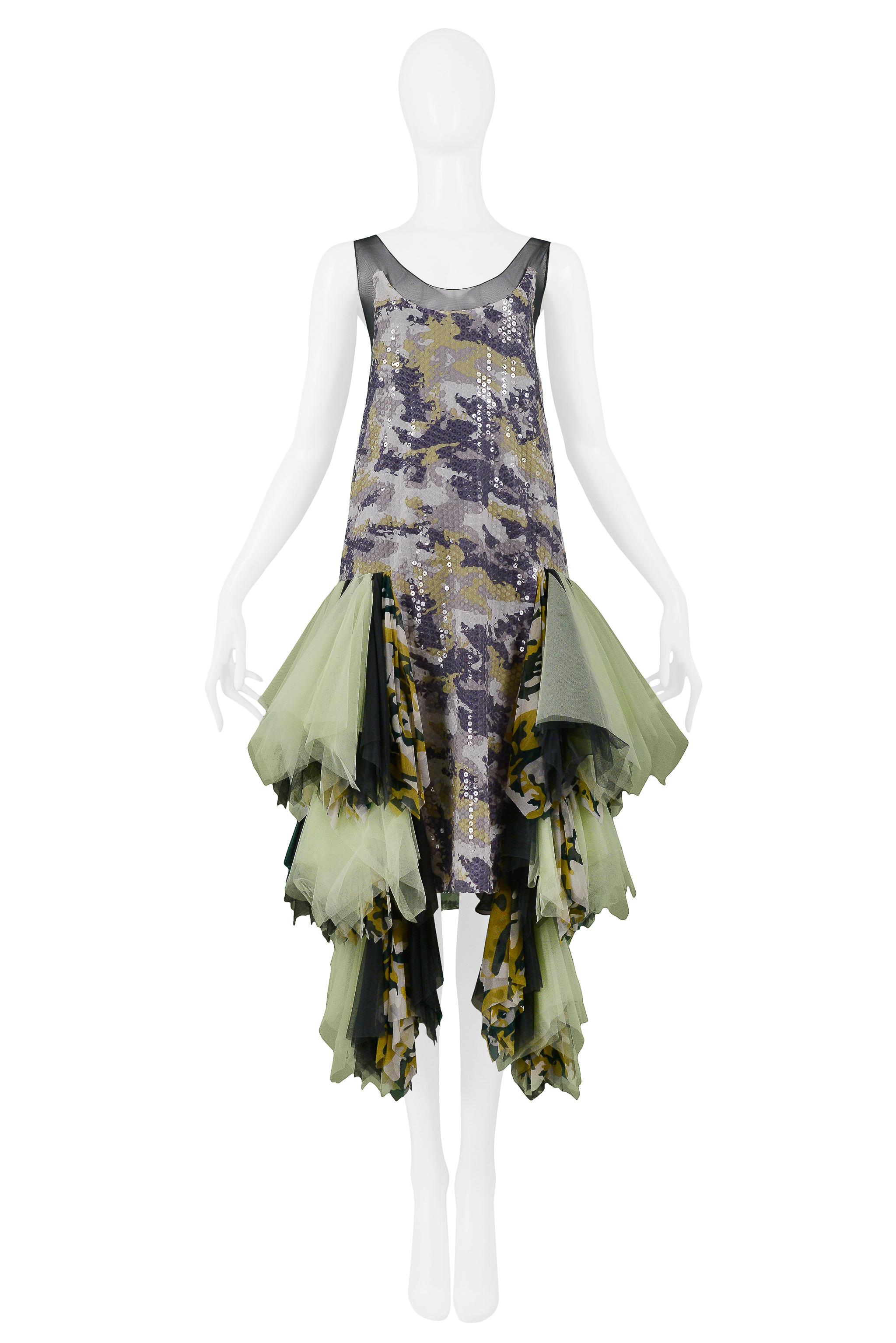 We are excited to offer an important vintage Alexander McQueen green, purple, and grey camo robe-de-style slip dress featuring sheer mesh straps, clear sequins, and multicolor green & camo chiffon ruffled tiers at hips. The dress fits like a vintage