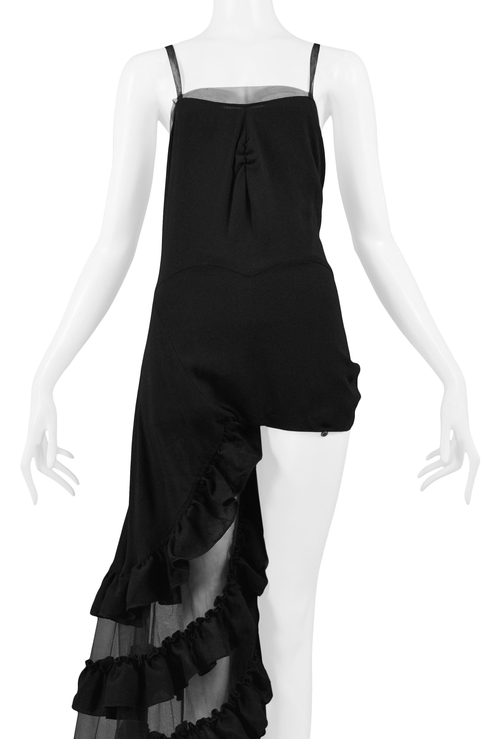 We are excited to offer this iconic black Alexander McQueen one-legged evening gown from the SS 'NO. 13', 1999 runway collection. The gown's wrap skirt can be buttoned to expose one leg or buttoned to create a full skirt (both legs covered). Shown