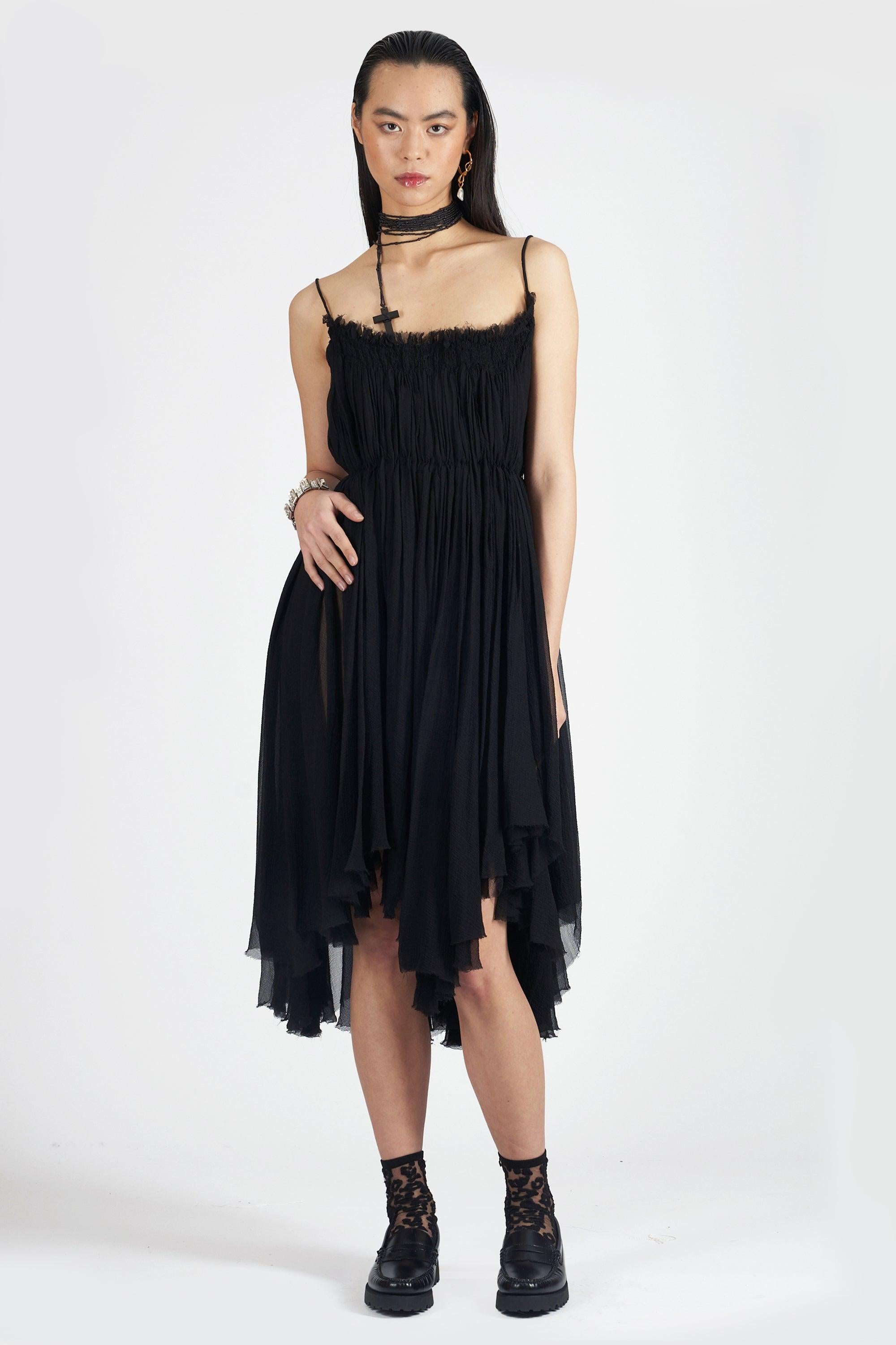 We are excited to present this incredible Alexander McQueen Spring Summer RTW 2003 ‘Harness’ ruched silk dress. Features a square neckline, spaghetti straps and asymmetric midi length. In excellent vintage condition. Authenticity guaranteed.

Label