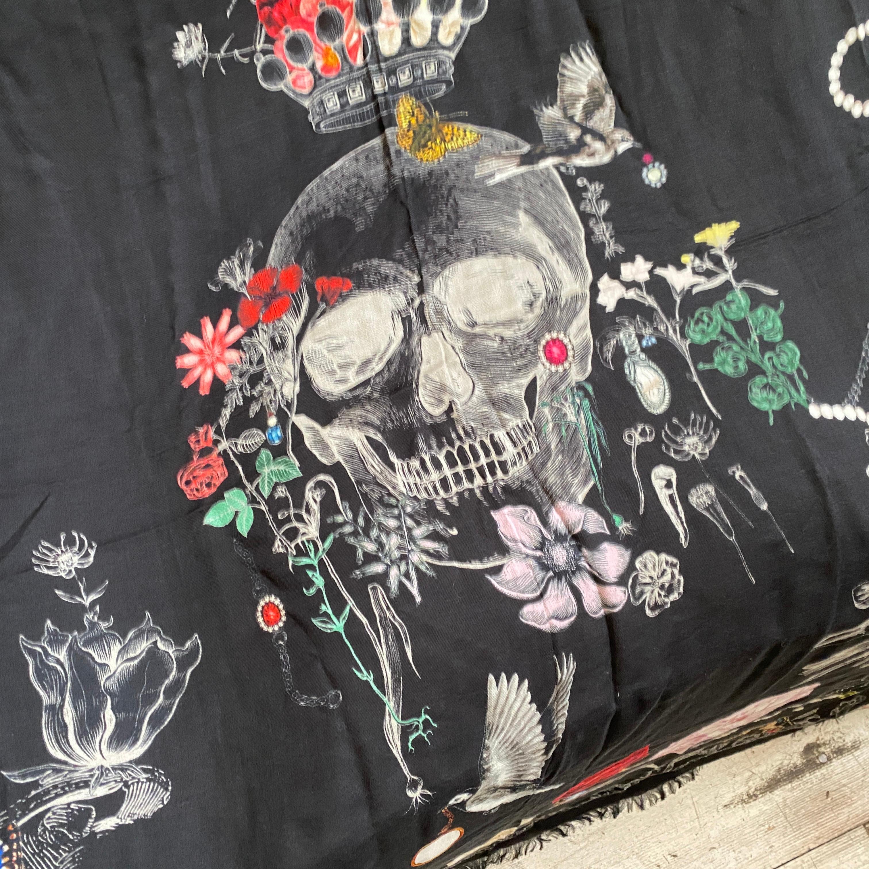 A gorgeous black scarf decorated with Skulls, Birds, Flowers and Butterflies designed by Alexander McQuenn