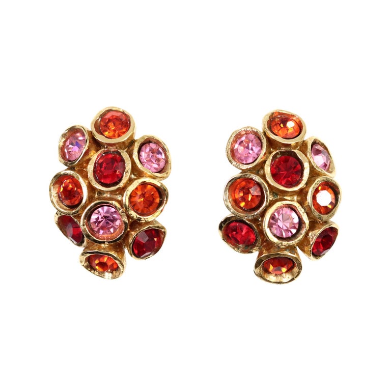 Vintage Alexis Lahellec Gold Honeycomb with Red and Pink Earrings Circa 1980s. Each little piece of the honeycomb is at a different level and has either a pink or red crystal which looks so great in the gold. Clip On.

Will match amazing with the