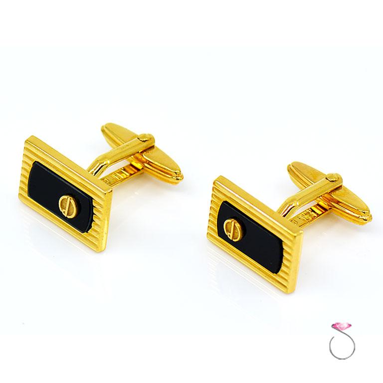 Rectangular shaped black onyx cuff links, gold plated. The black onyx measure 1.2 cm in length and 0.6 cm in width. The cufflinks measure 2 cm in length and 1.8 cm in width. Pre-owned in excellent condition. Hallmarked 