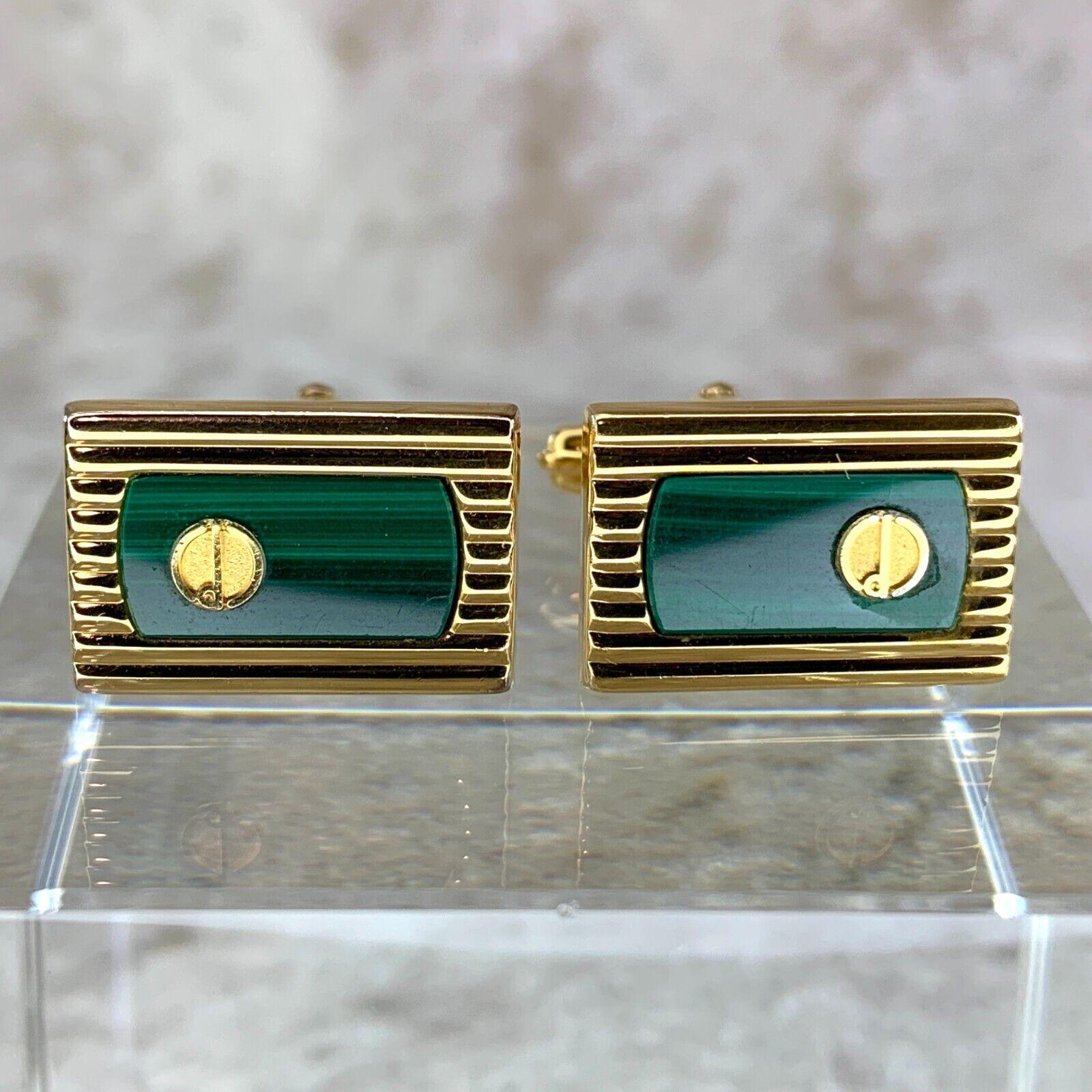 Vintage Alfred Dunhill Cufflinks & Tie Clip Green Malachite Gold Plated 
Circa 1990
Gold Plated 
Malachite gems 
In original Dunhill case 
18k Gold plating 
Signed Dunhill 
Logo 