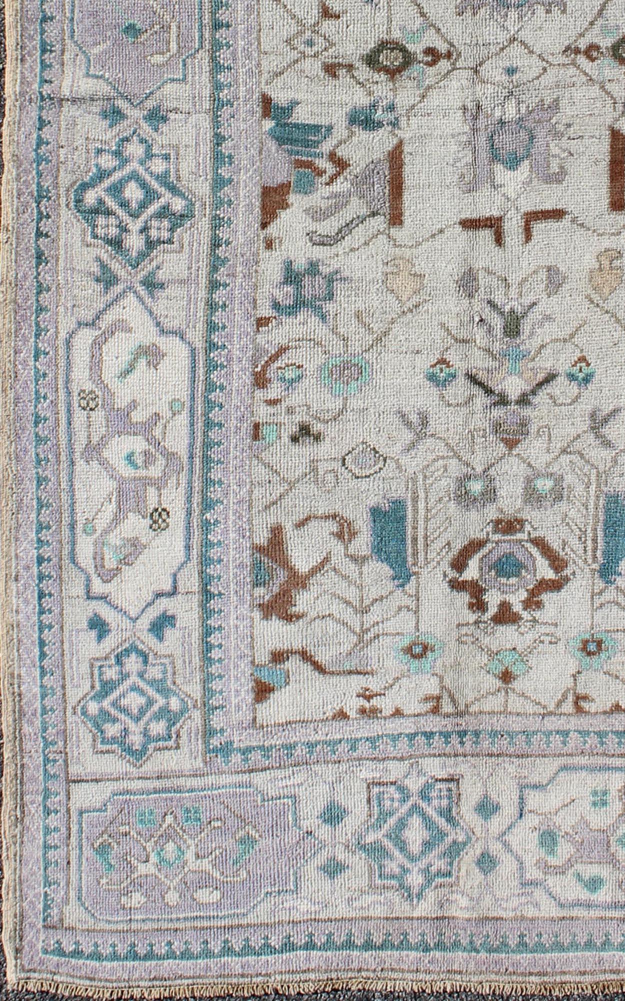 Vintage All-Over Floral Turkish Oushak Area Rug in Cream, Blue, Lilac and Brown In Good Condition For Sale In Atlanta, GA