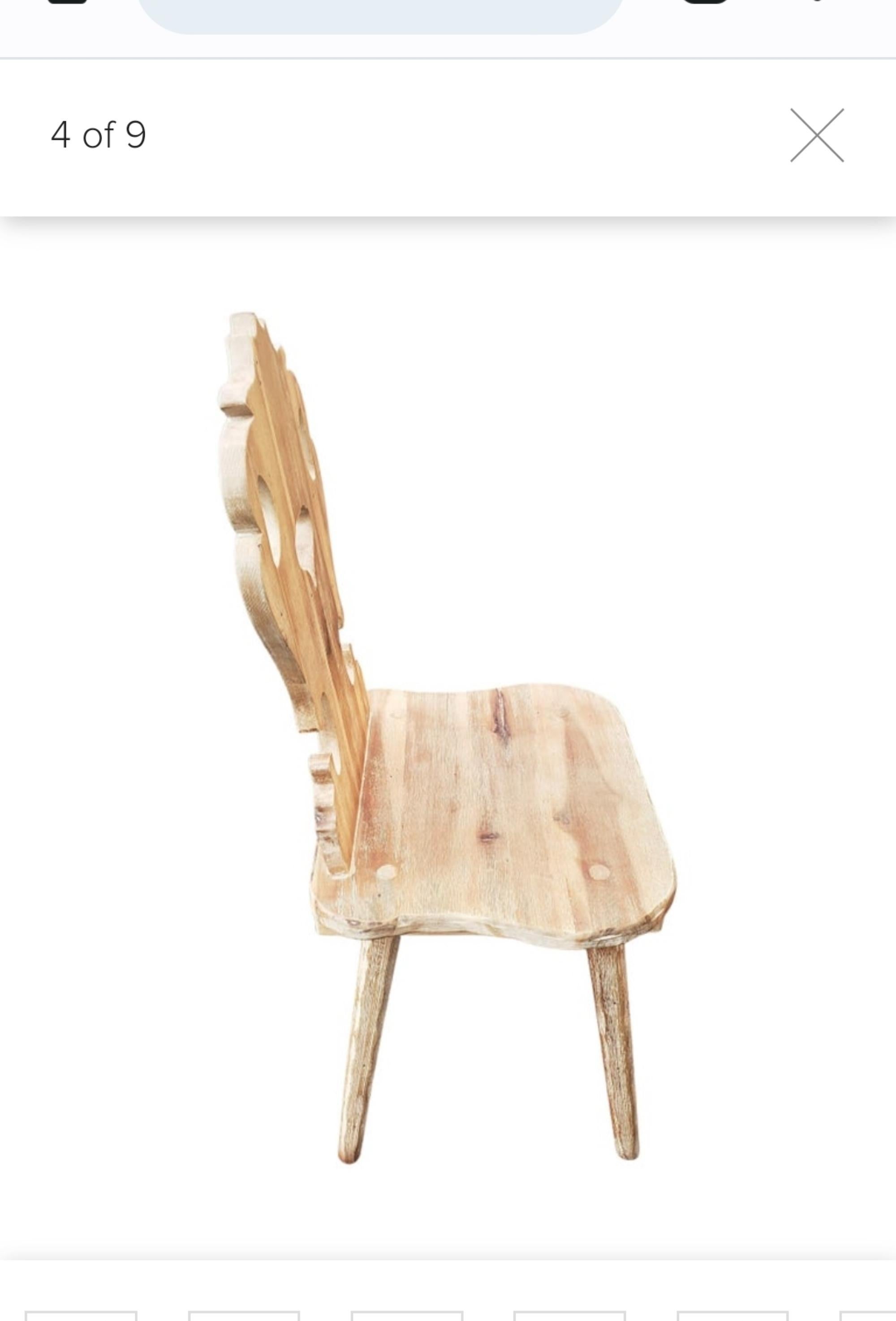 A stunning  vintage alpine swiss side chair in solid Elm. This was made in Switzerland and date from circa 1960s. It is of amazing quality and has a beautiful design, with elegant splayed legs, shapely backs and cut out heart motifs. We have had