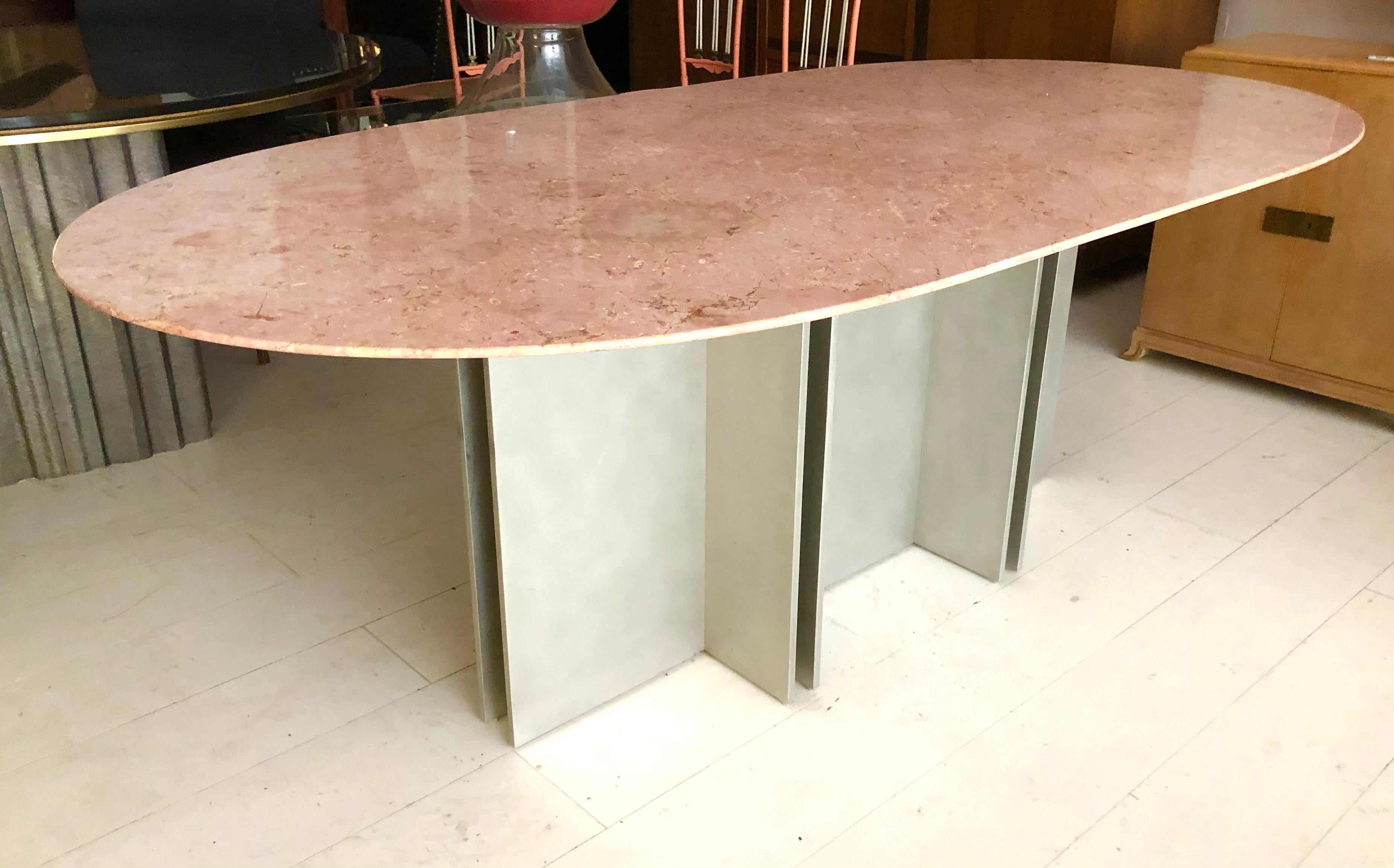 c. 1970s, likely Italian, the architectural, heavy gauge aluminum base supports a thick oval marble top carved with razor edge bevel. Would make an impressive desk. Designer unknown but incredible build quality and design