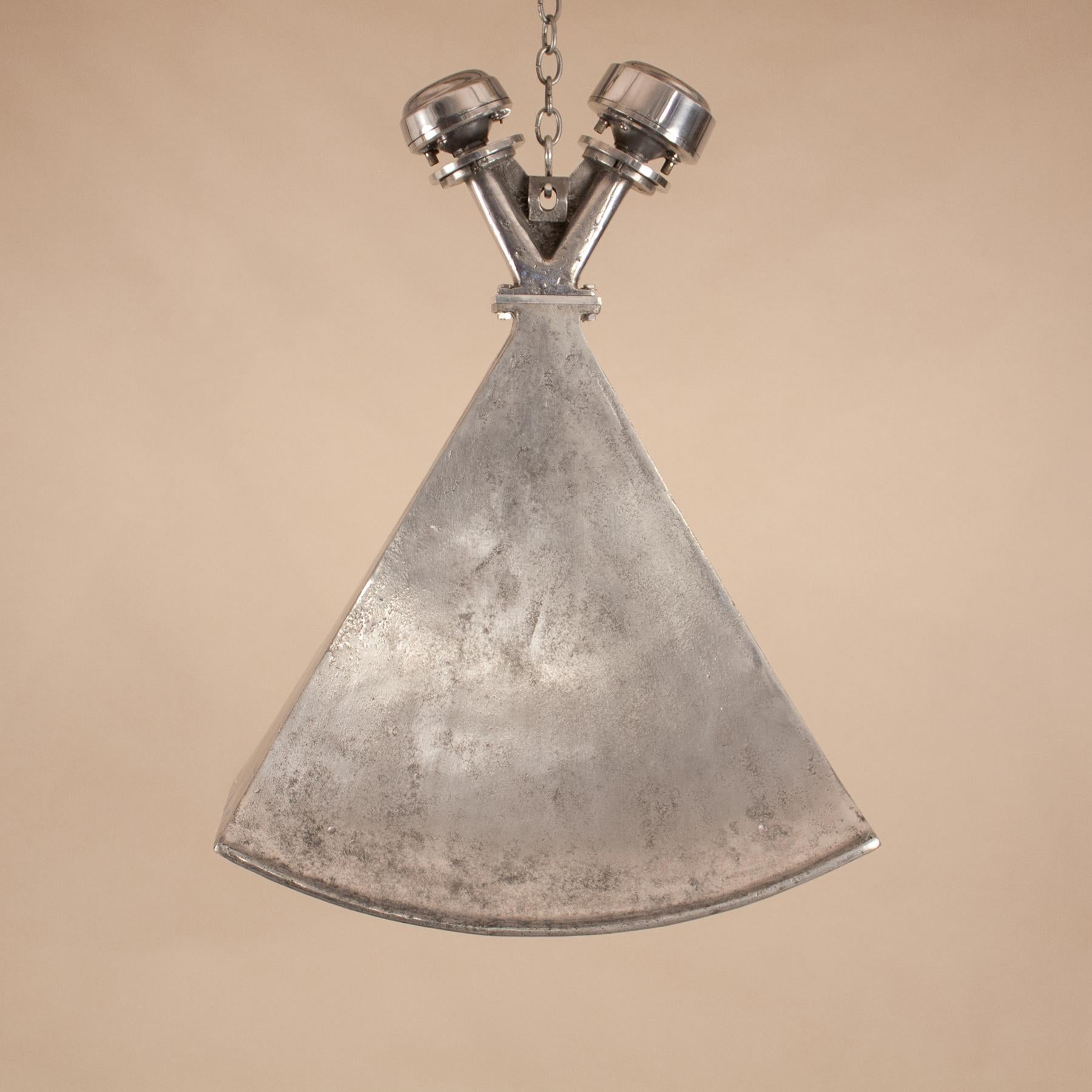A circa 1950 Bombay movie theatre horn loudspeaker finds new life as an industrial style pendant. This aluminum light has very appealing form and its original distressed patina. Manufactured by Ahuja Radio of India, the speaker is also available