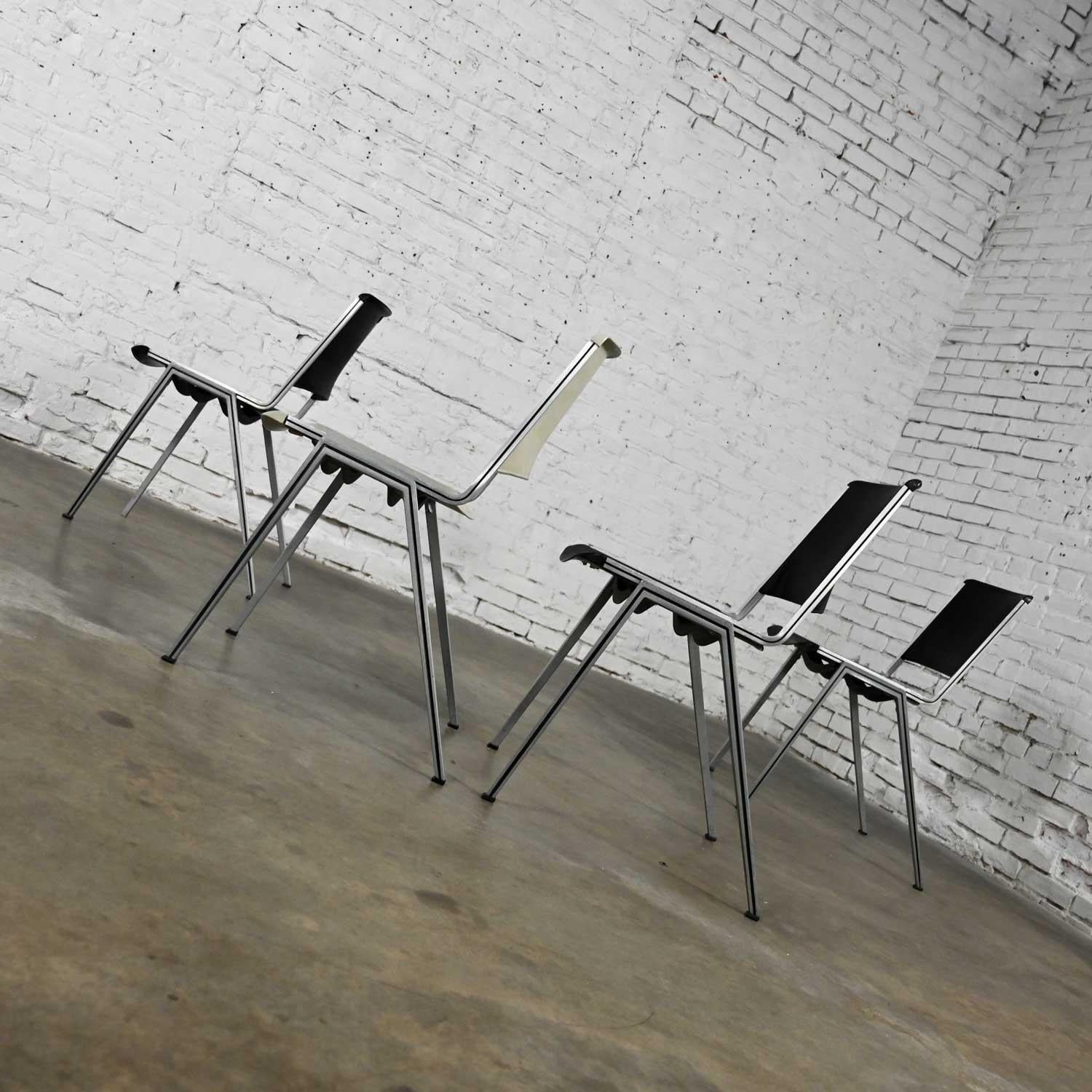Vintage Aluminum Steelcase Stacking Chairs Model #1278 1 White 3 Black Set of 4 In Good Condition For Sale In Topeka, KS