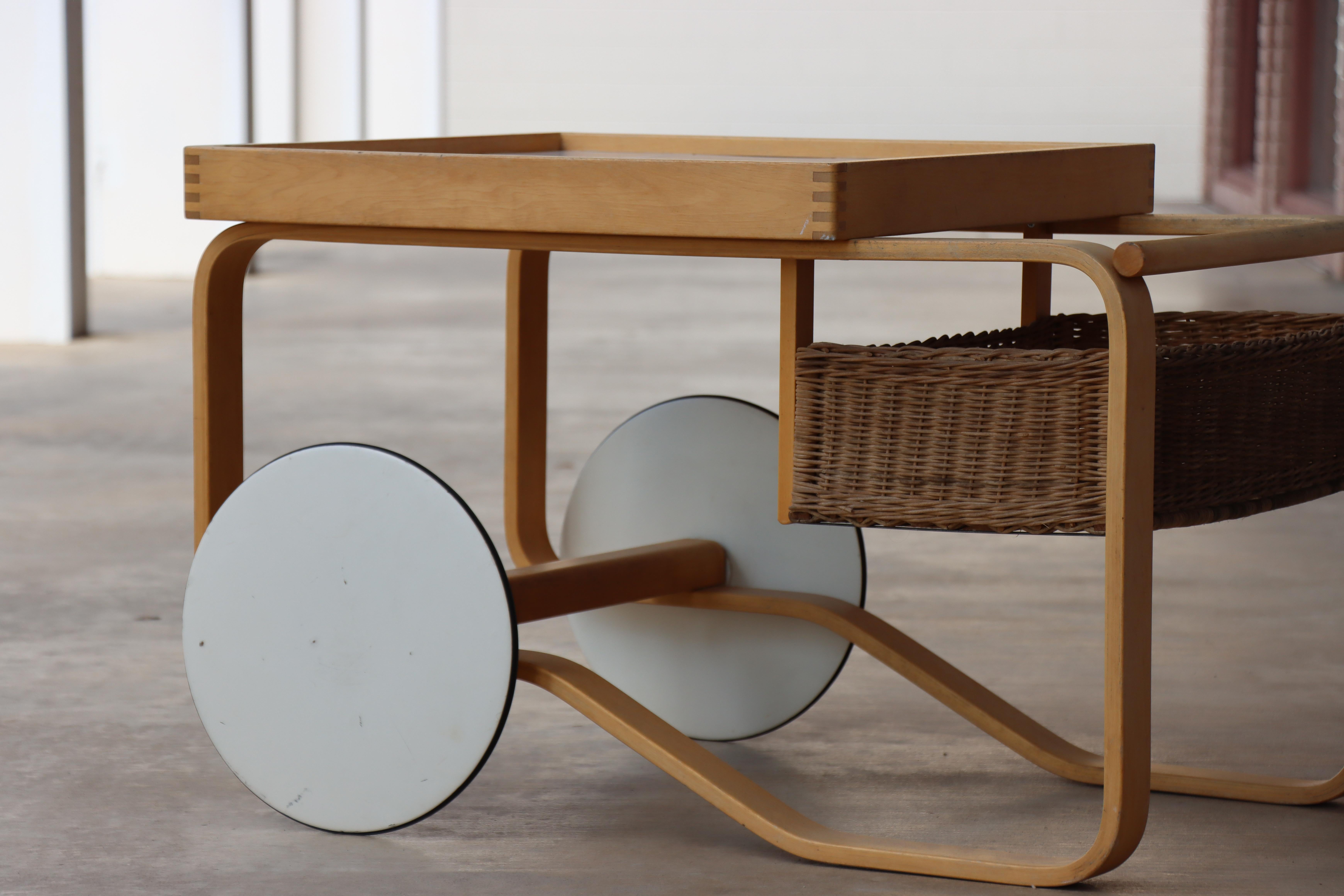 Vintage ‘Tea Trolley 900’ cart designed in 1937 by Aino and Alvar Aalto for the World Exhibition in Paris.

 Increasing difficult to get here in the US, the trolley features a white ceramic-tiled top and has an attached rattan basket. The frame is