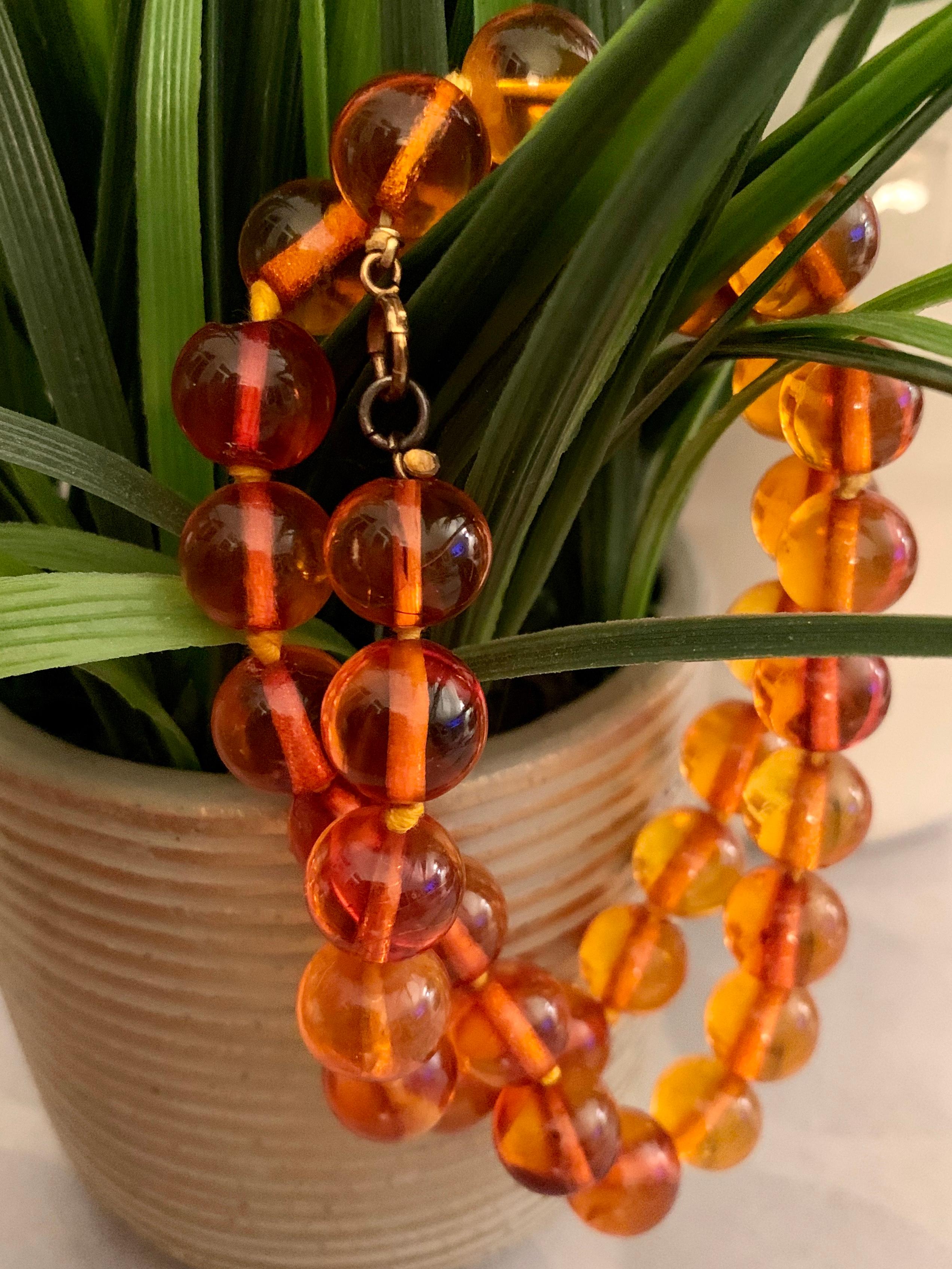 This Amber necklace features 13mm beads, many of which have bugs embedded; a true find for those of us who love that in our Amber!  

This necklace is 21