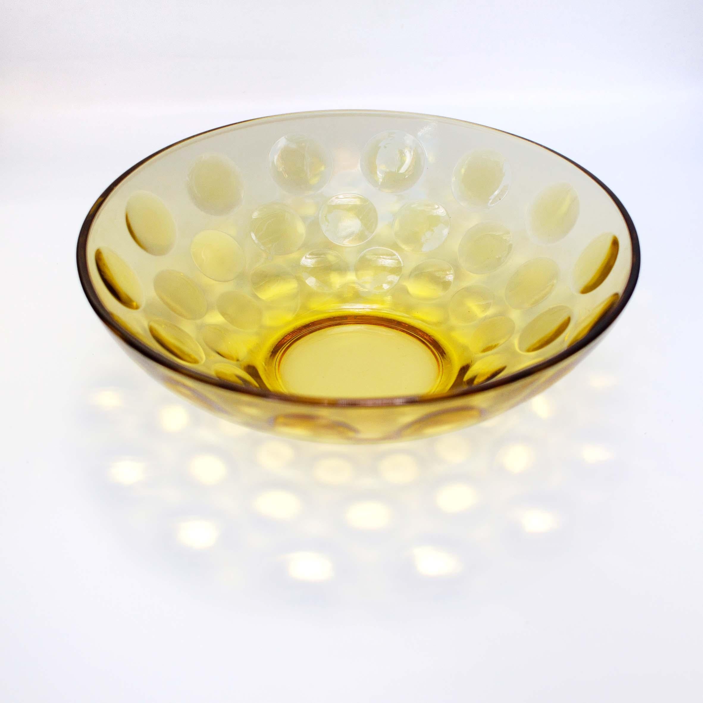Vintage Amber crystal bowl, 1970s 

Glass
Measures: 9 x 3 in.

Yellow crystal bowl with circle indentations decorating the outer layer. Perfect for holding fruits, salads, or just a centerpiece decoration. 



All sales are final.
   