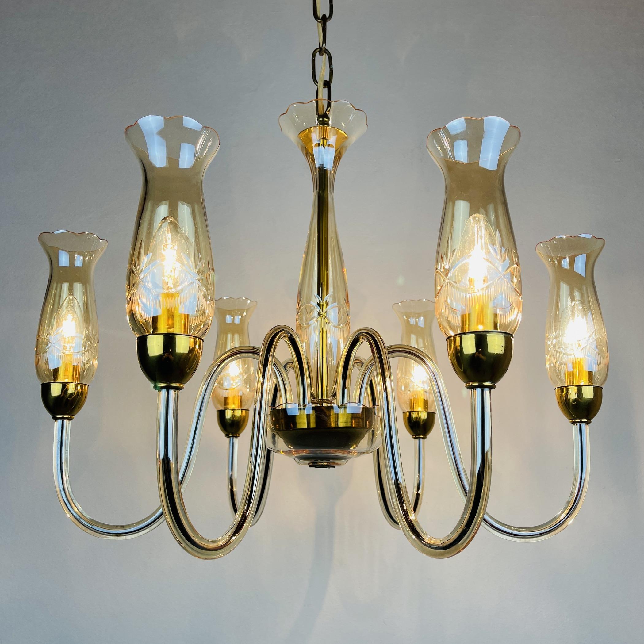 Incredibly beautiful rare Murano glass chandelier.
The mid-century chandelier was made in Italy by De Majo in the 1970s.
Vintage chandelier made entirely of glass with small brass fittings. In very good condition. No cracks and chips. The wiring