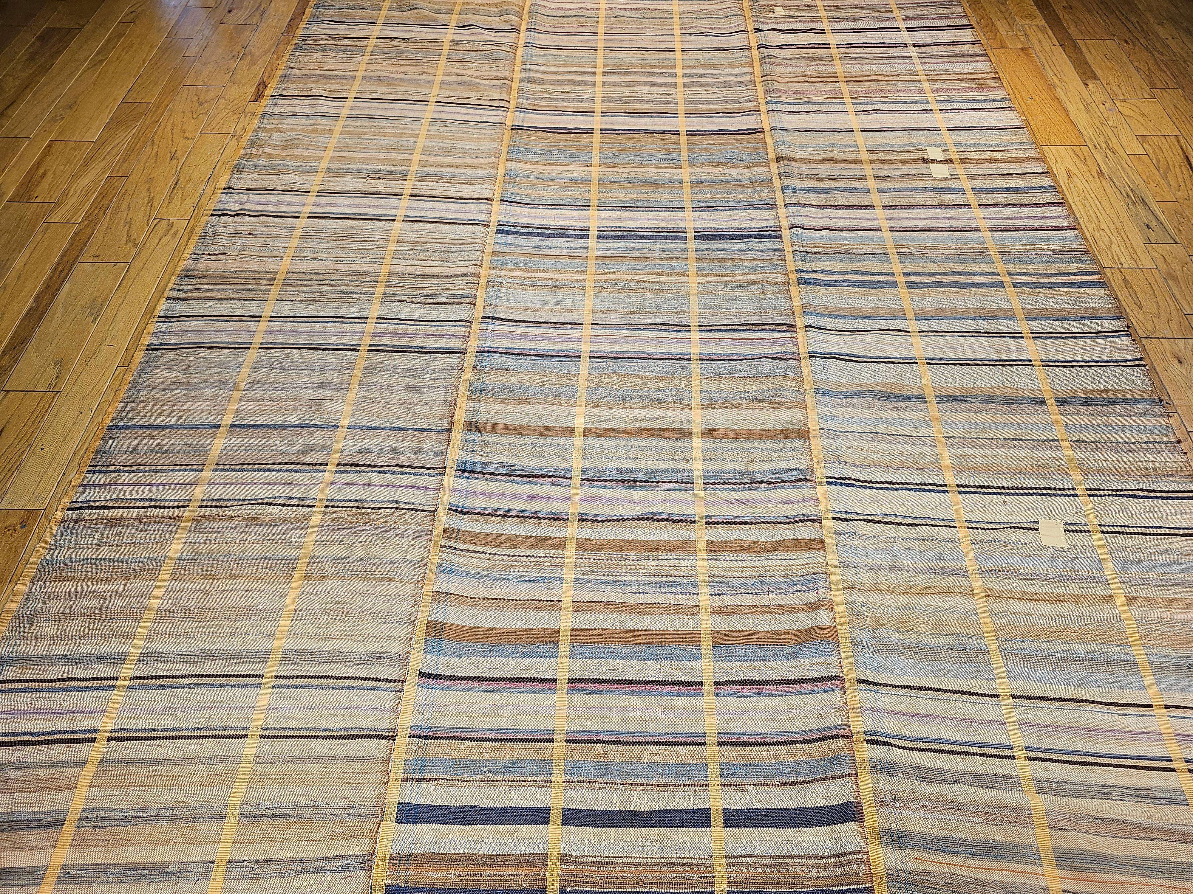 This beautiful multicolor American Amish Rag Area Rug has a very modern design format and can be incorporated into any modern interior design project. The American Rag Area Rug is formed by joining three different individually woven runners to make