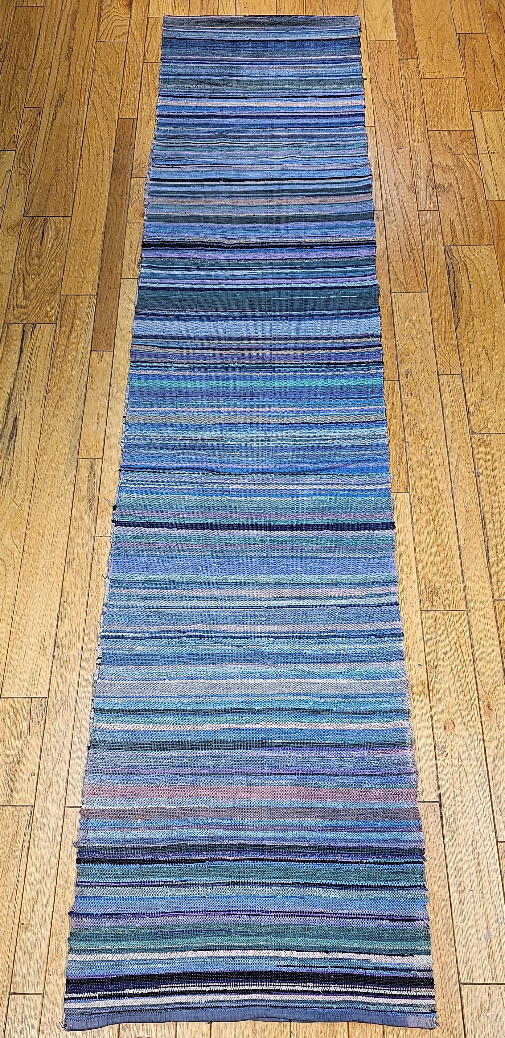 Vintage American Amish Rag Runner is in stripe design and has a very modern design format and can be incorporated into any modern interior design project. This Amish Rag Runner has a stripes pattern in sage green, red, chocolate,  brown, and orange