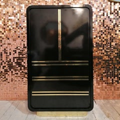 Armadietto alto e dorato vintage art deco revival nero e oro / tallboy anni '80
