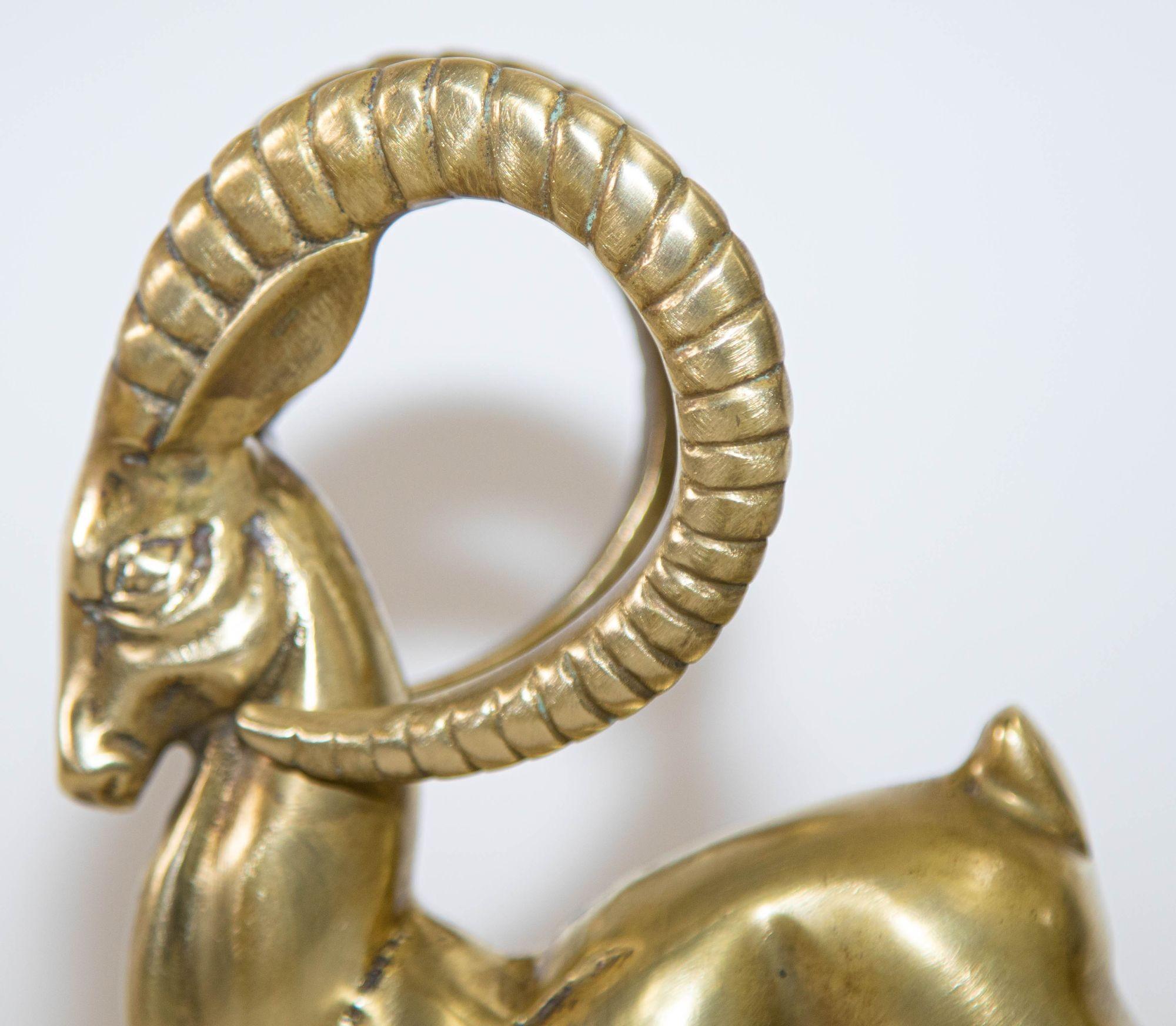 Vintage French Art Deco Style Sculpture of Brass Ibex Antelope.
Beautiful elegant art Deco Hollywood Regency style cast brass ram, gazelle antelope sculpture mounted on a brass base plate.
Antelopes are a symbol of speed, grace wild beauty is