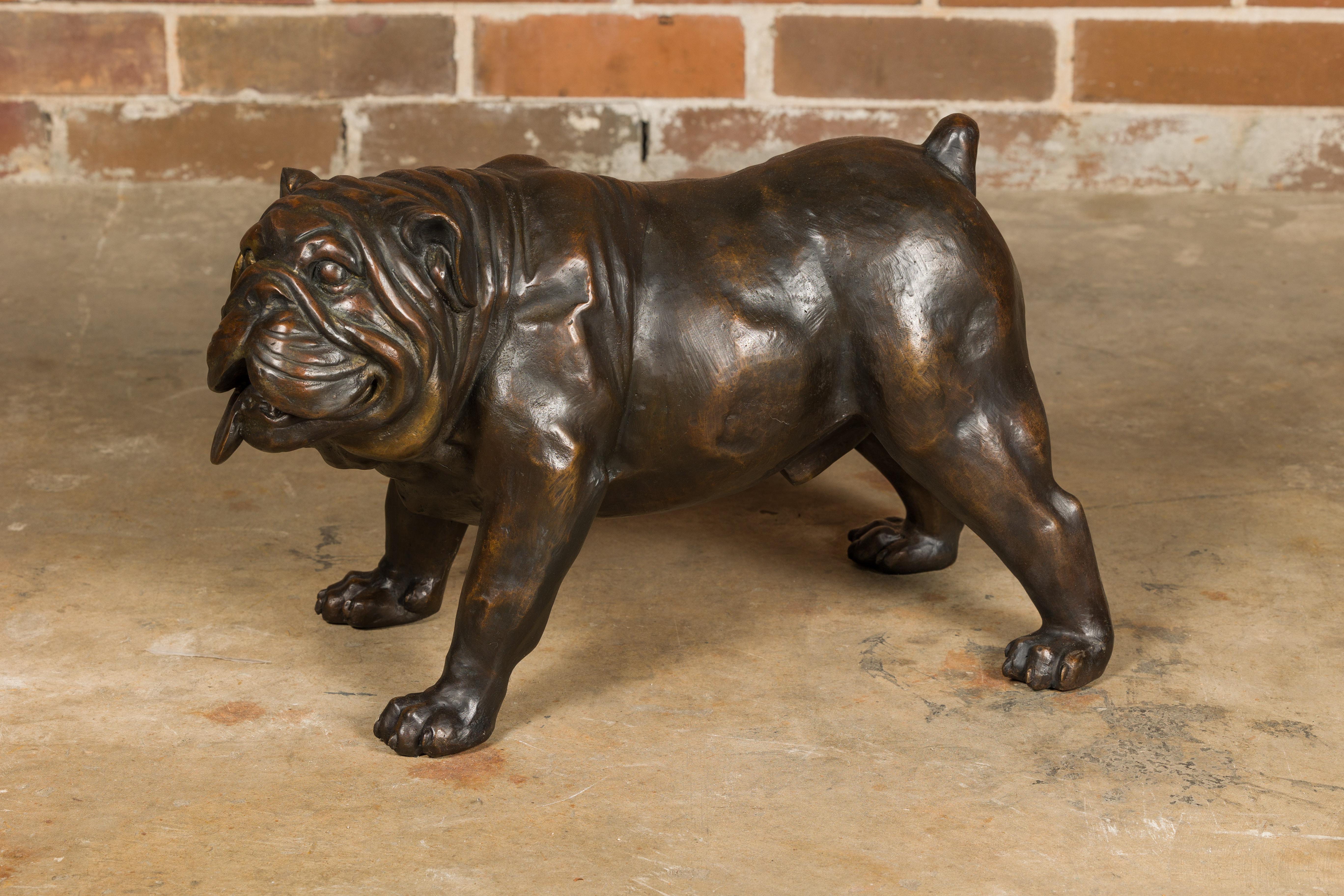 A vintage life-size bronze bulldog sculpture, American art. This vintage American art piece, a life-size bronze sculpture of a bulldog, exudes character and charm. The sculpture captures the essence of the beloved breed with incredible attention to